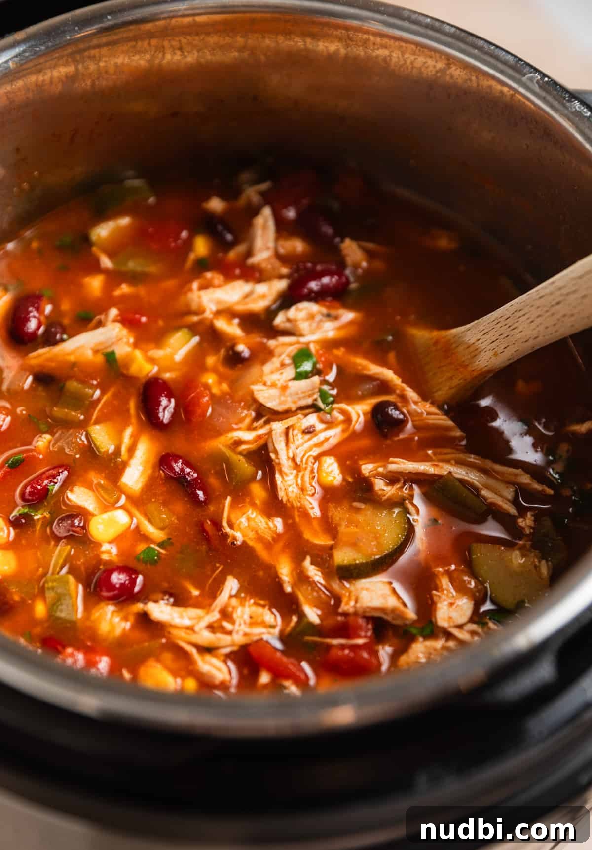 Instant Pot Chicken Tortilla Soup Recipe 10 Instant pot chicken tortilla soup with wooden spoon.
