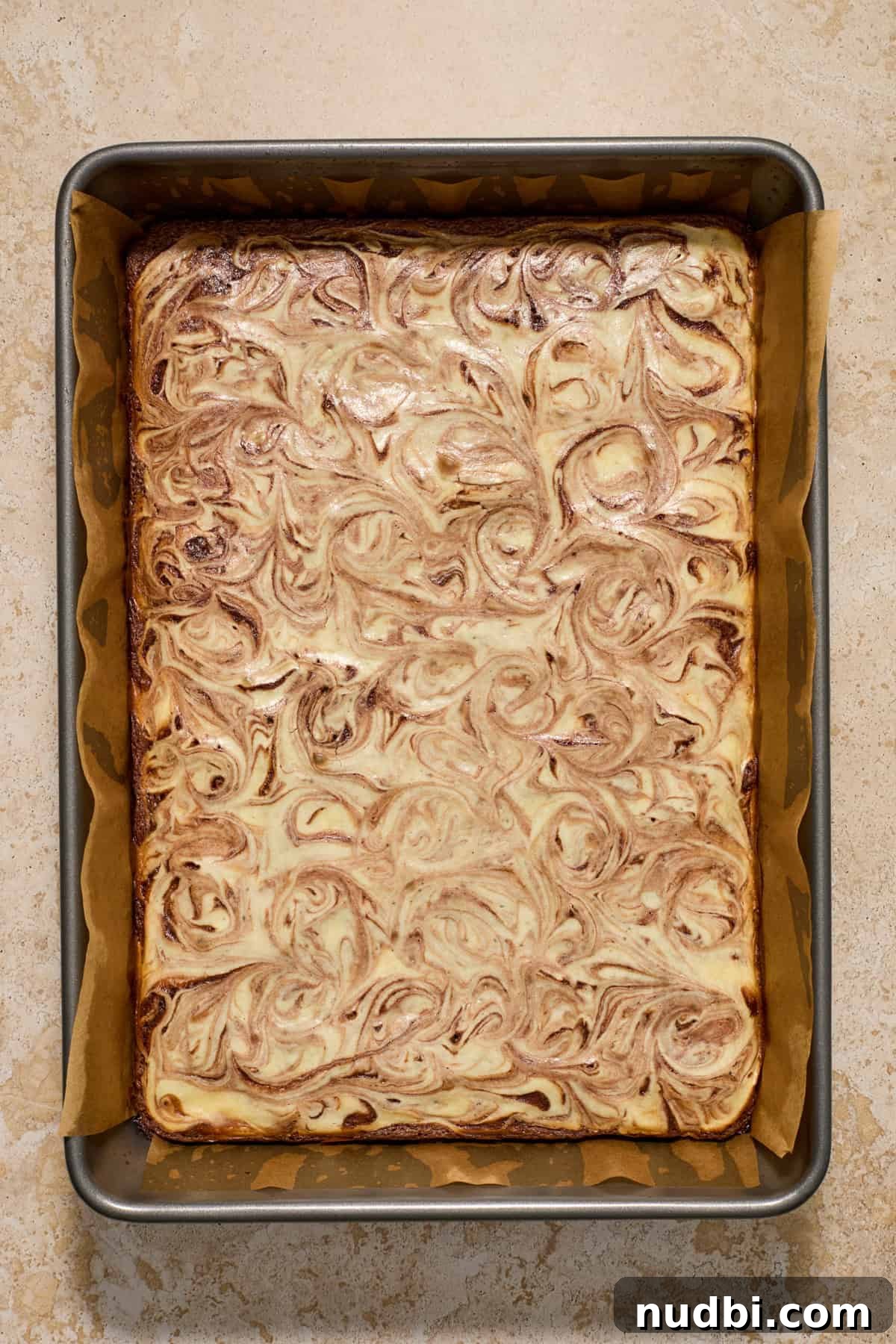 Kahlúa Cream Cheese Brownies Recipe — Luscious Coffee-Chocolate Swirl 10 Baked kahlua brownies in baking pan.