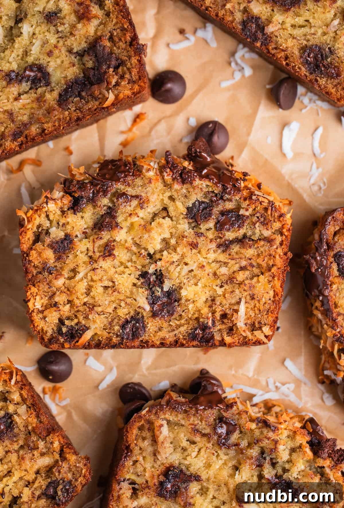 Coconut Banana Chocolate Chip Bread Recipe 2 Coconut chip banana bread on parchment.