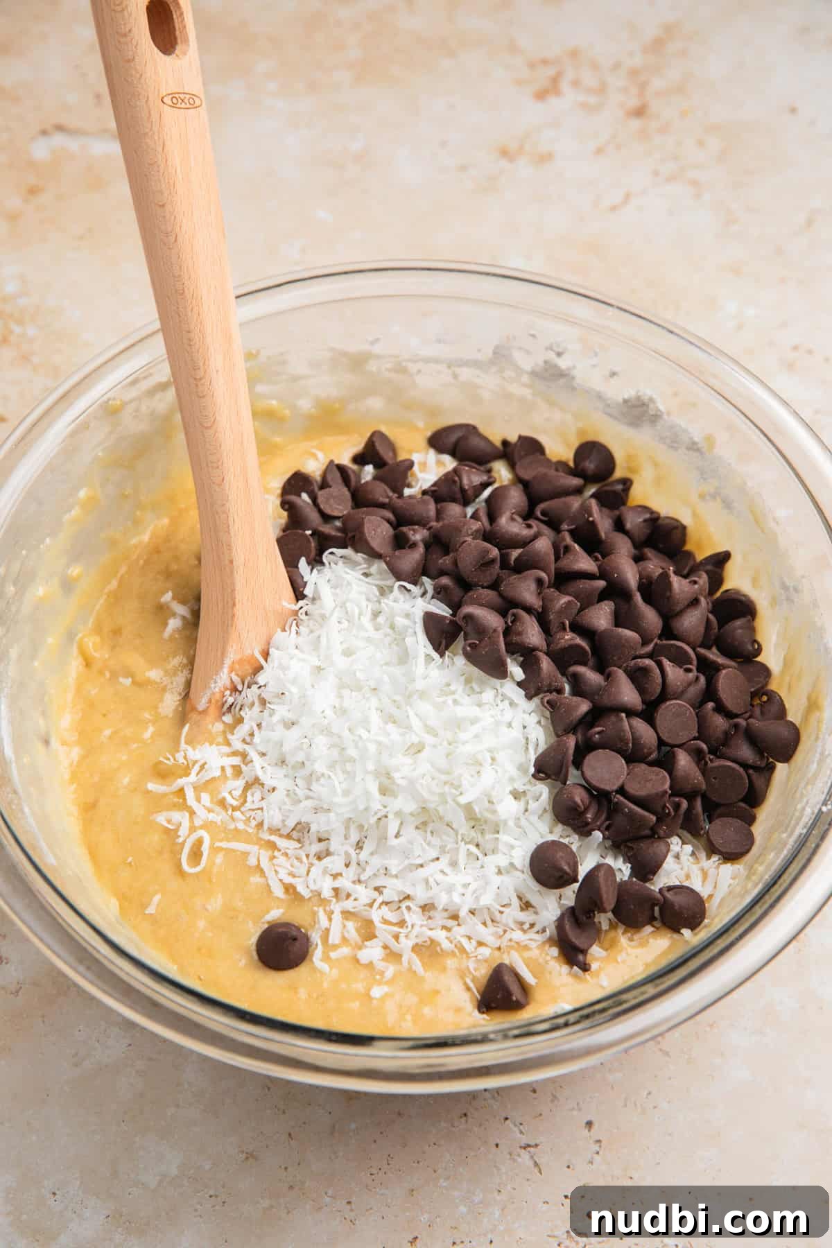 Coconut Banana Chocolate Chip Bread Recipe 9 Banana bread batter with coconut and chocolate chips added.