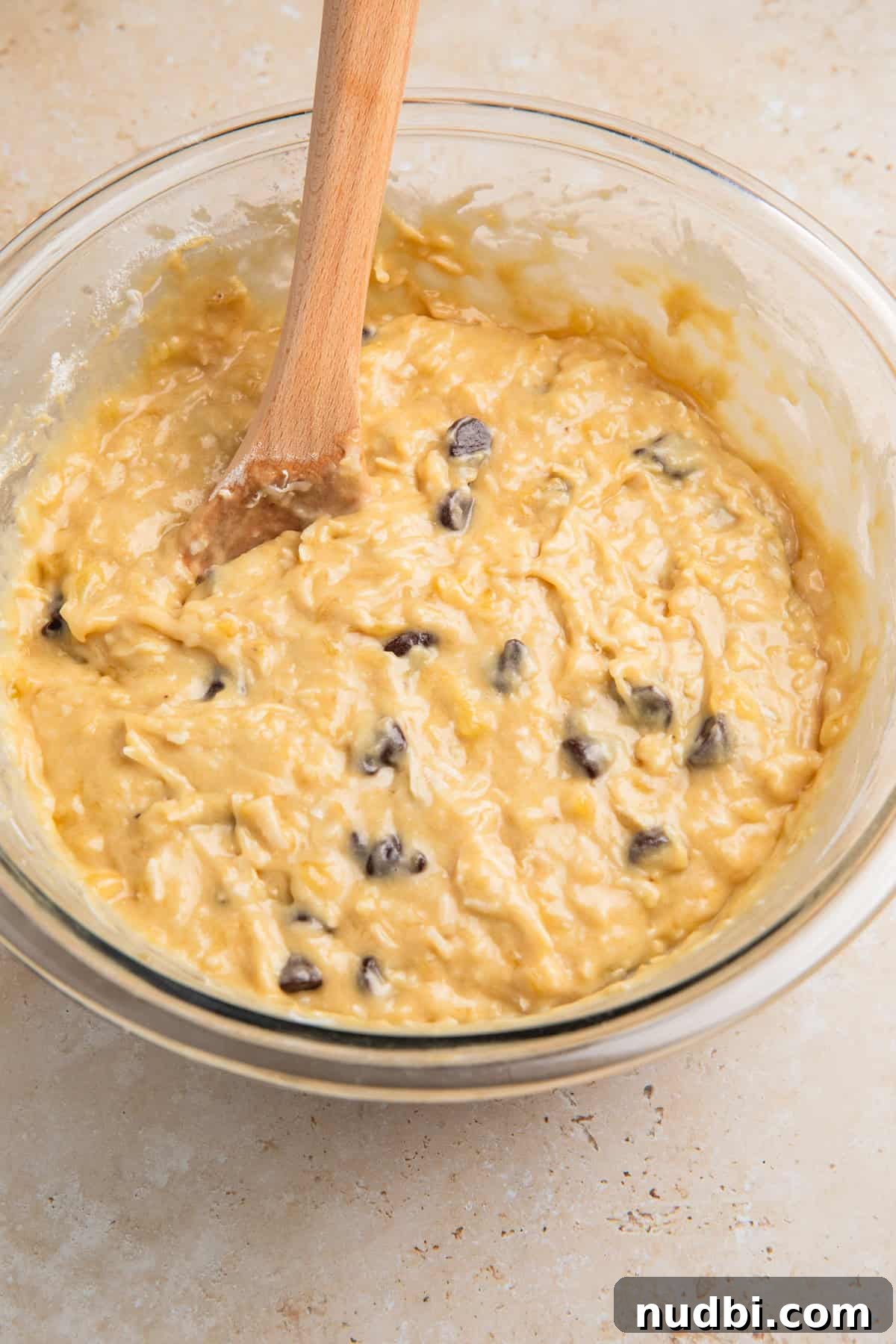 Coconut Banana Chocolate Chip Bread Recipe 10 Coconut banana bread batter with chocolate chips in it.