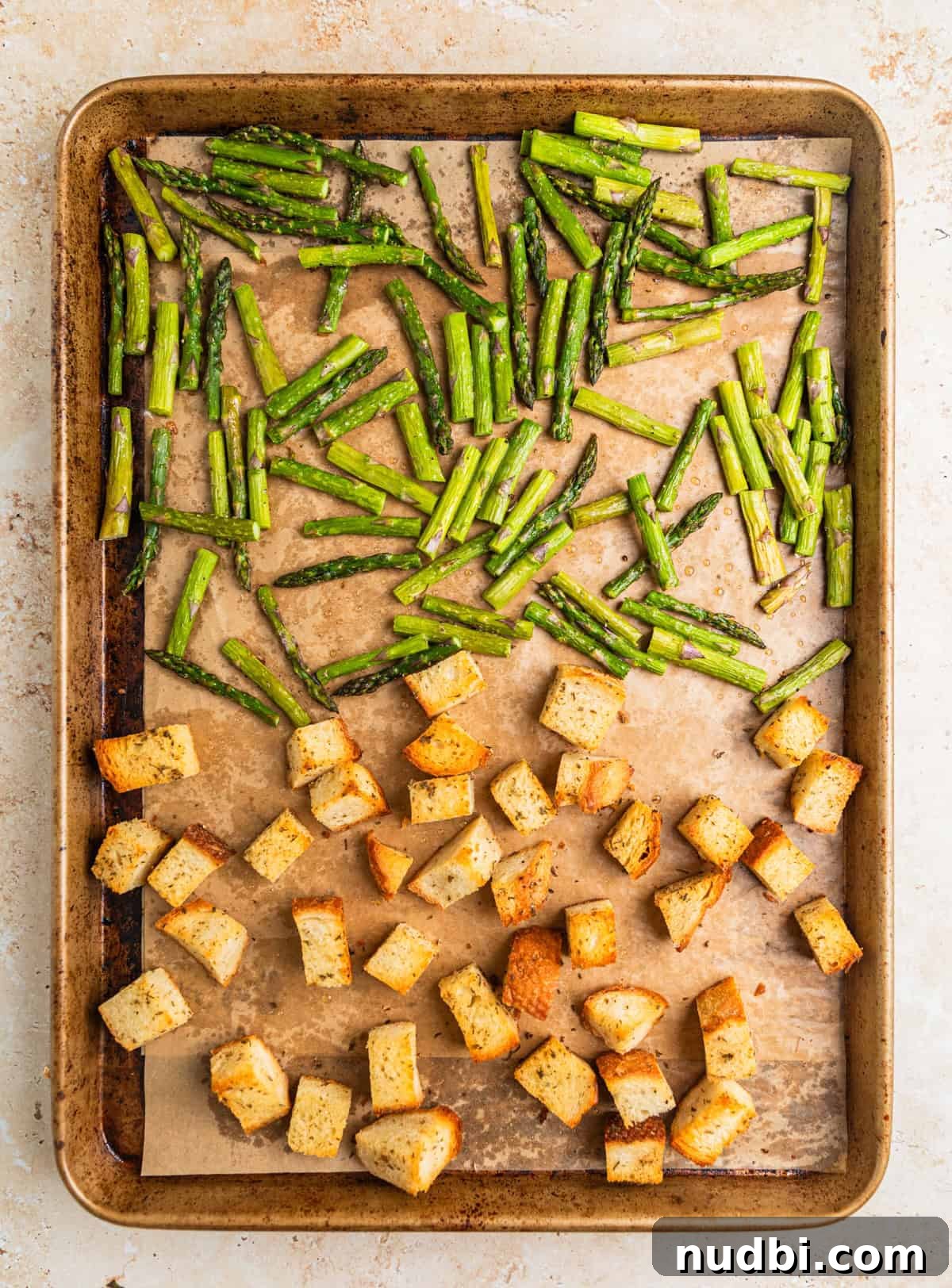 Spring Green Burrata Salad with Lemon Herb Vinaigrette 6 Baked sourdough croutons and asparagus on parchment lined sheet pan.