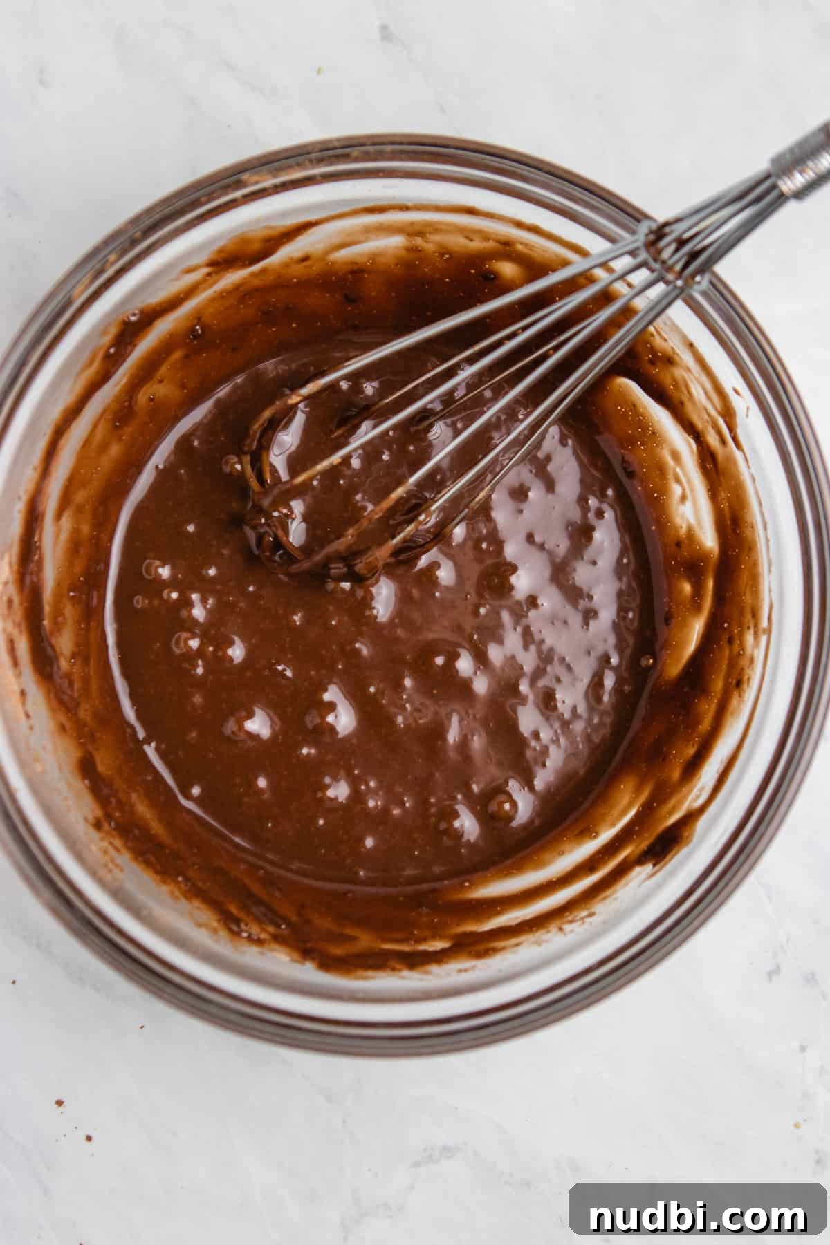 Quick Nutella Mug Cake Recipe for a Warm Chocolate Treat 4 Whisked nutella mug cake batter in mixing bowl.