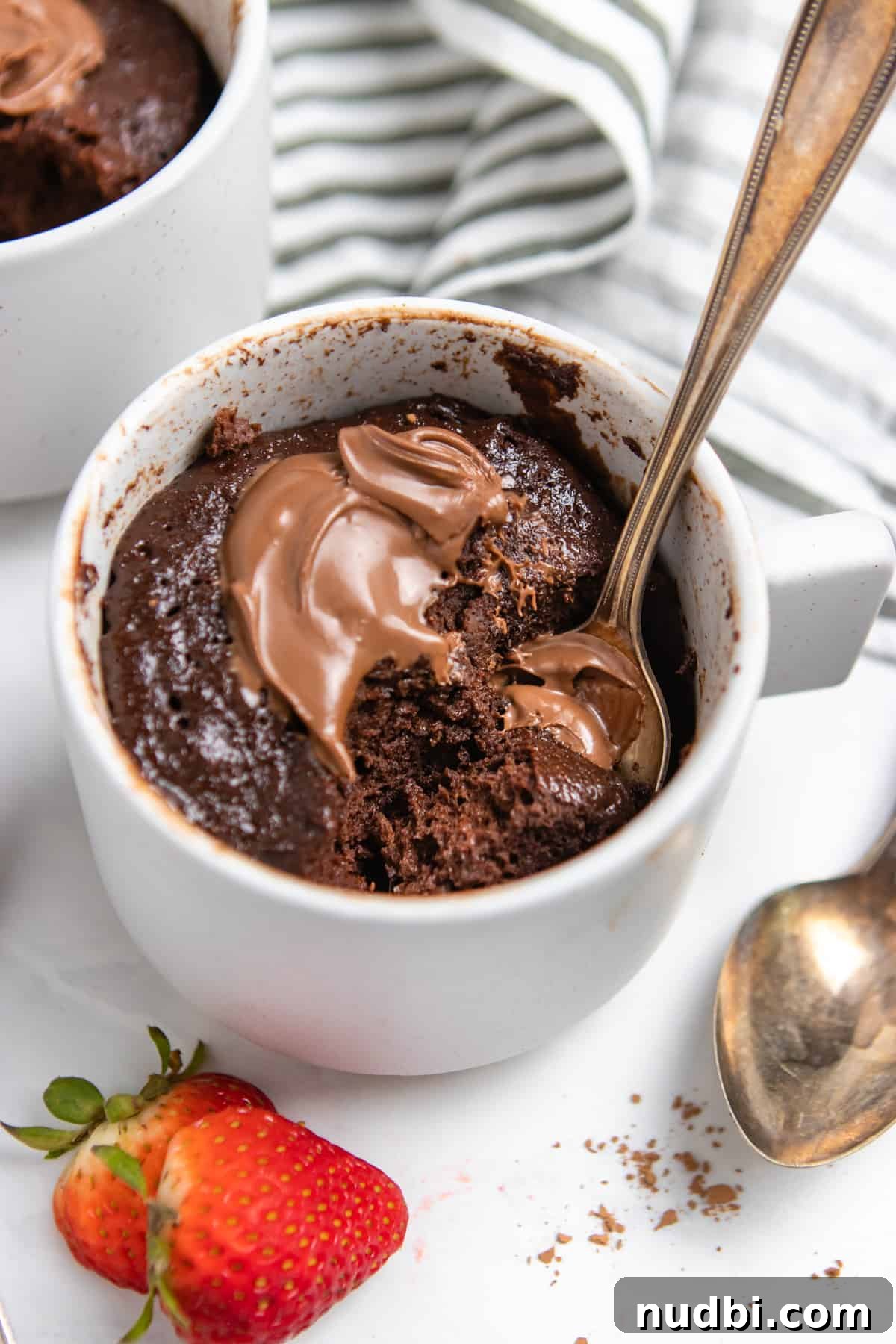 Quick Nutella Mug Cake Recipe for a Warm Chocolate Treat 6 Mug cake with nutella and strawberries.