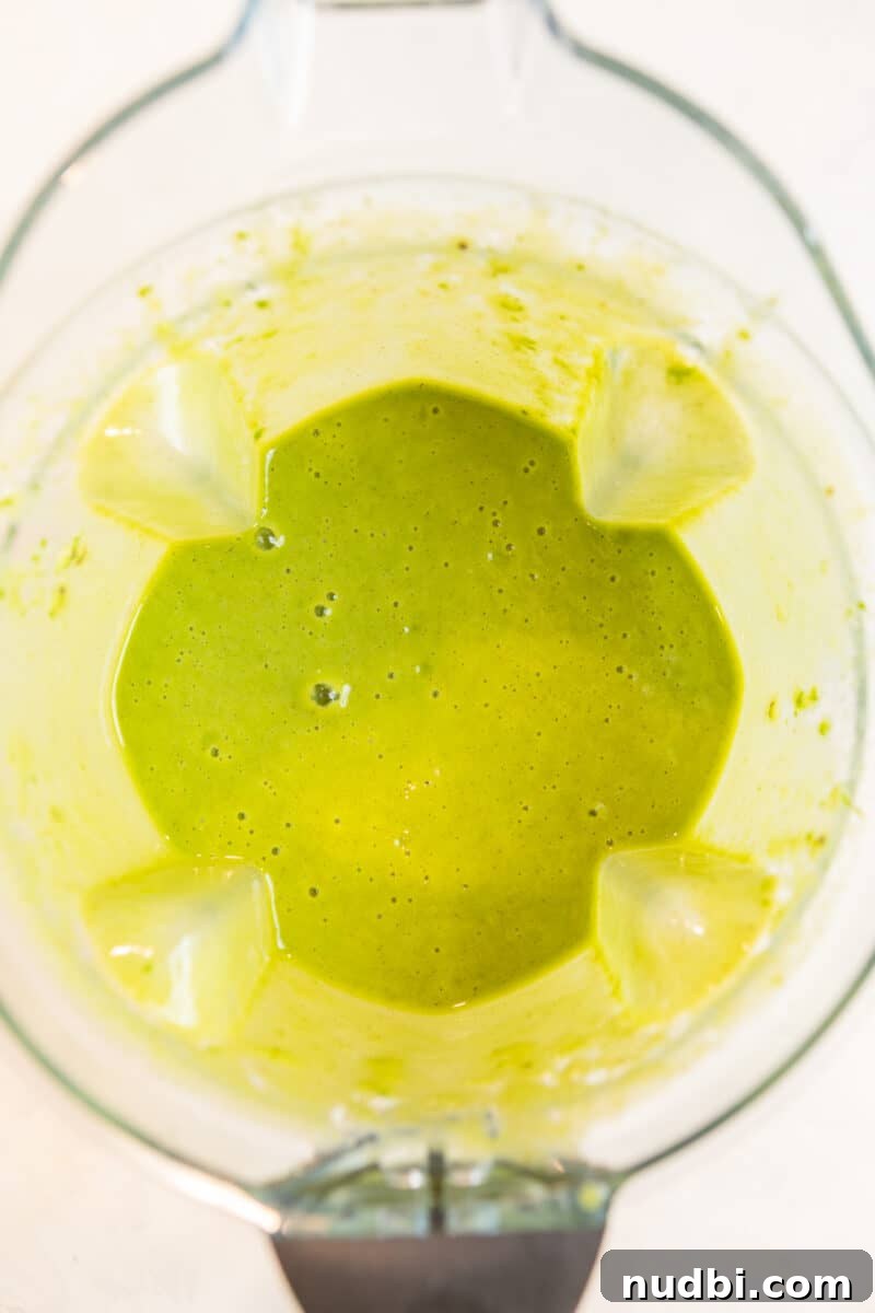 Pineapple Kiwi Smoothie Recipe for Fresh Morning Energy 4 Pineapple kiwi smoothie blended in blender.