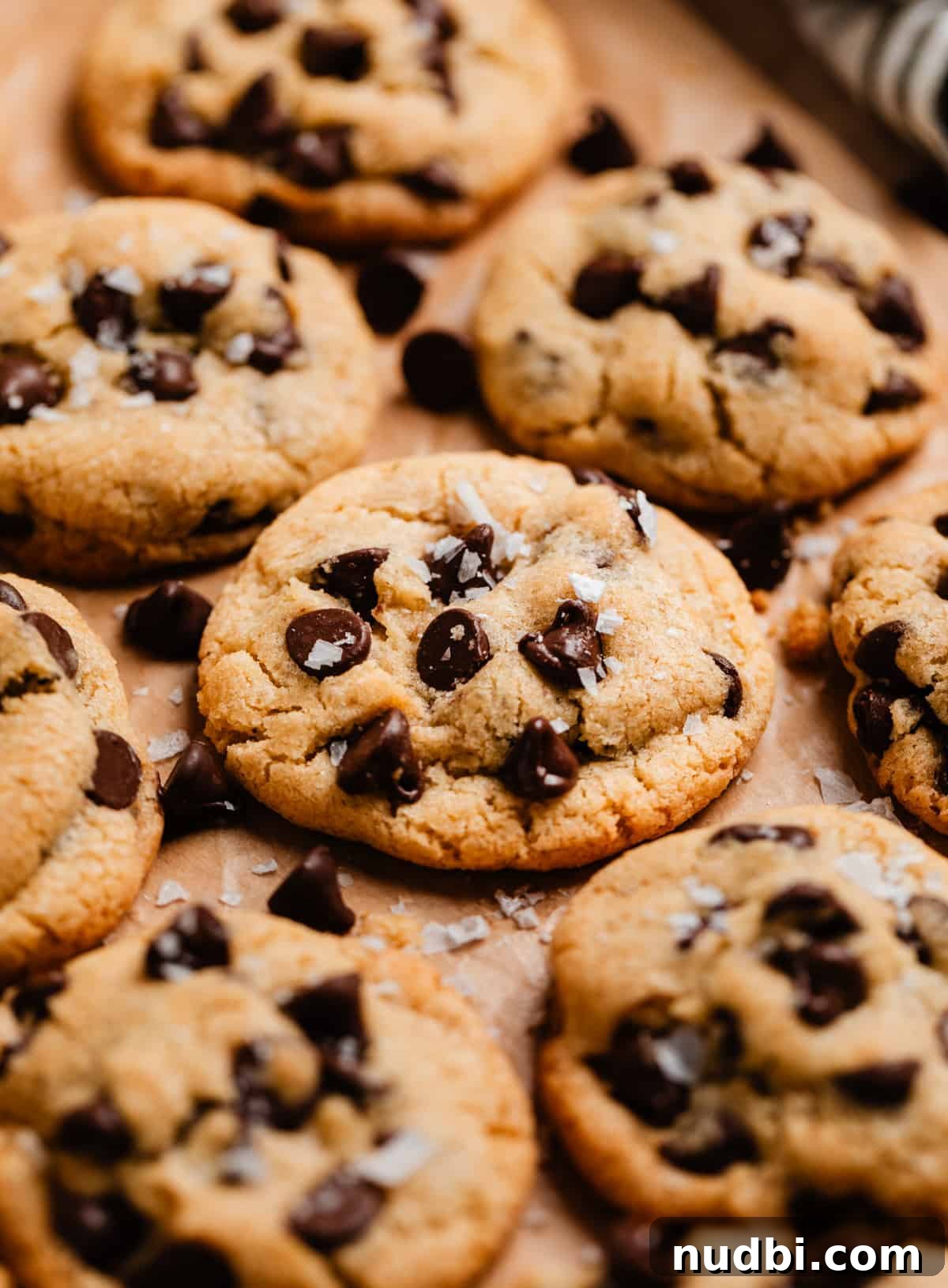 Small-Batch One-Bowl Chocolate Chip Cookies 2 Small batch chocolate chip cookies on parchment with sea salt sprinkled over top.
