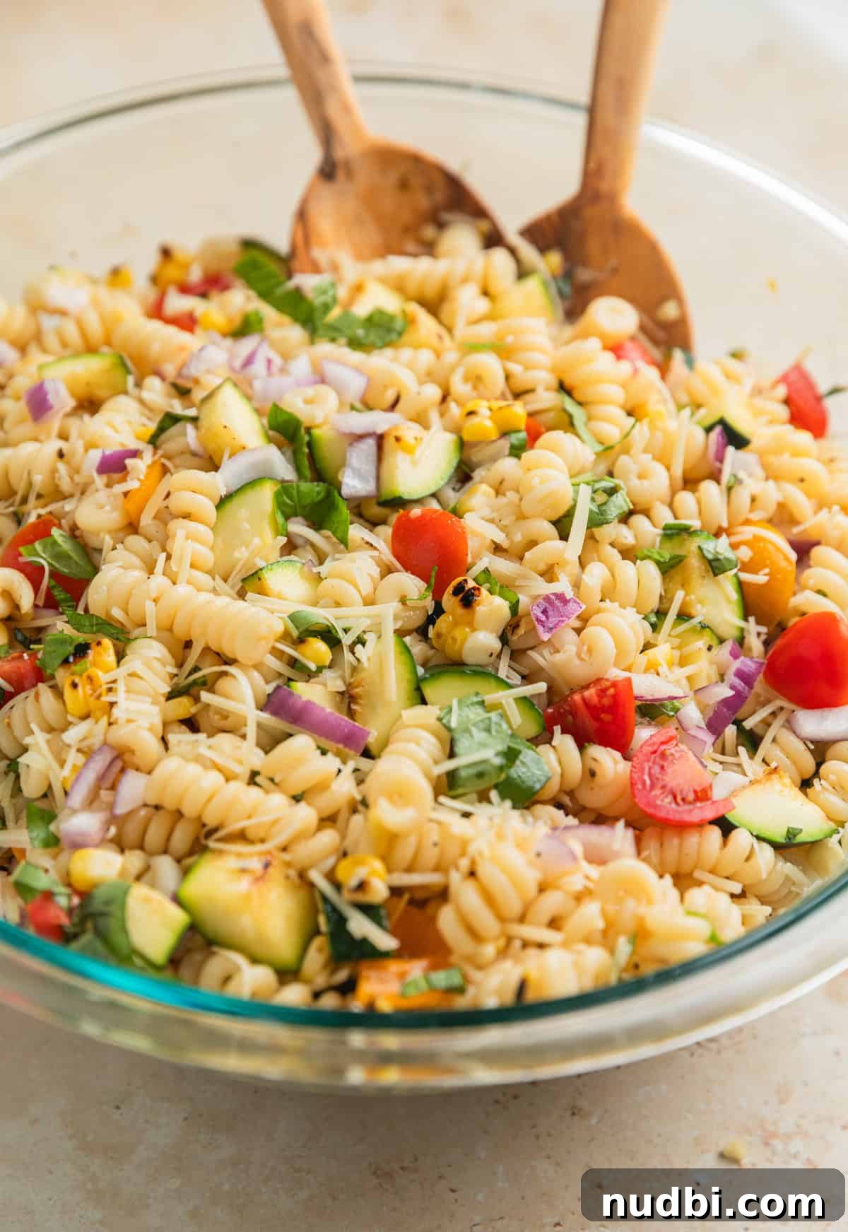 Grilled Zucchini Pasta Salad with Lemon Garlic Dressing 9 Tossed grilled vegetable pasta salad in glass mixing bowl.