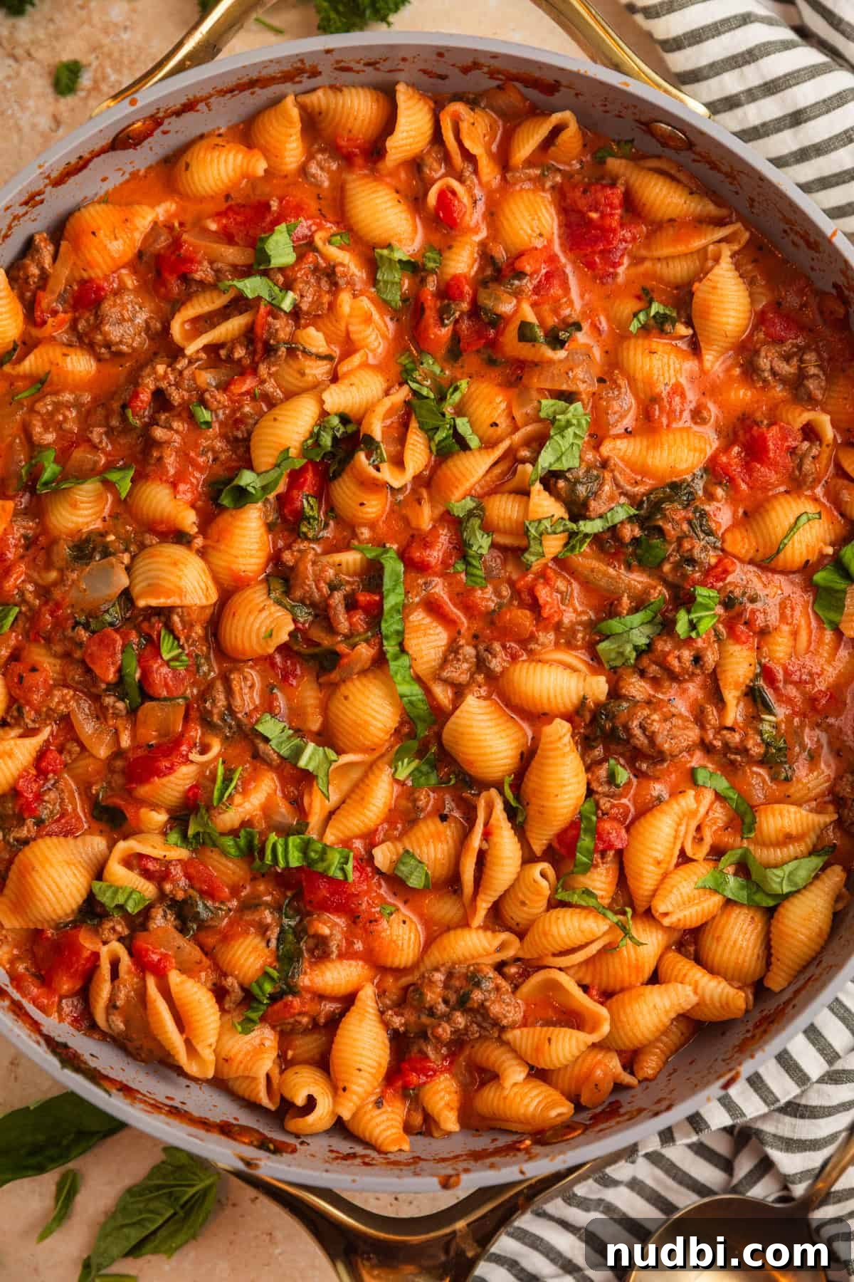 One-Skillet Ground Beef Pasta Skillet Meal 2 Ground beef pasta skillet topped with freshly chopped basil.