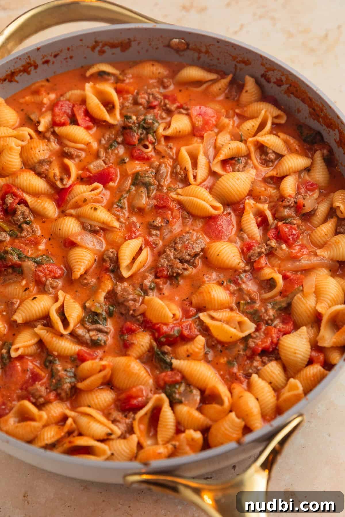 One-Skillet Ground Beef Pasta Skillet Meal 10 Ground beef pasta in tomato cream sauce in pan.
