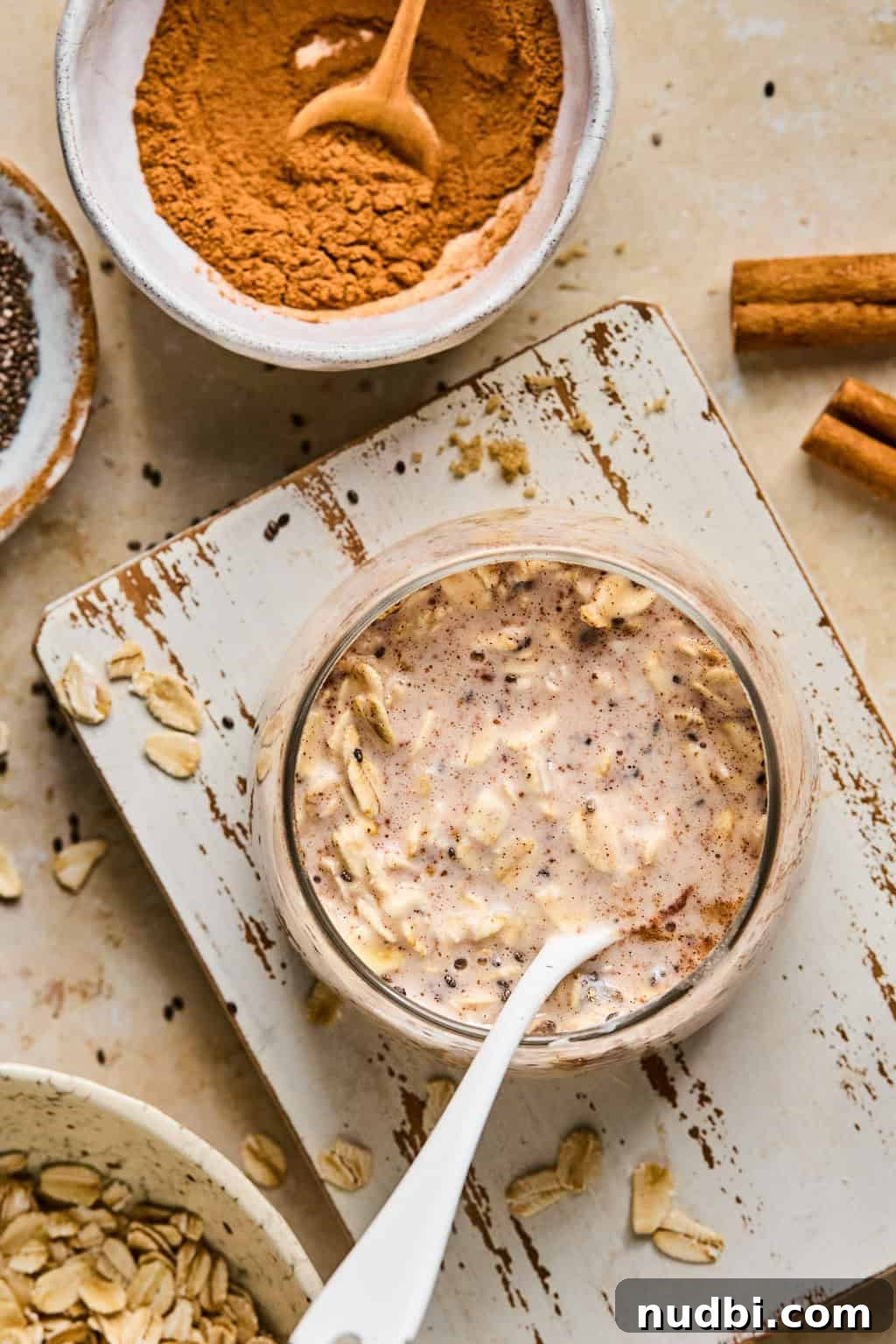 Cinnamon Roll Overnight Oats Recipe for Quick Morning Bliss 5 Stirred oats in glass before refrigerating.