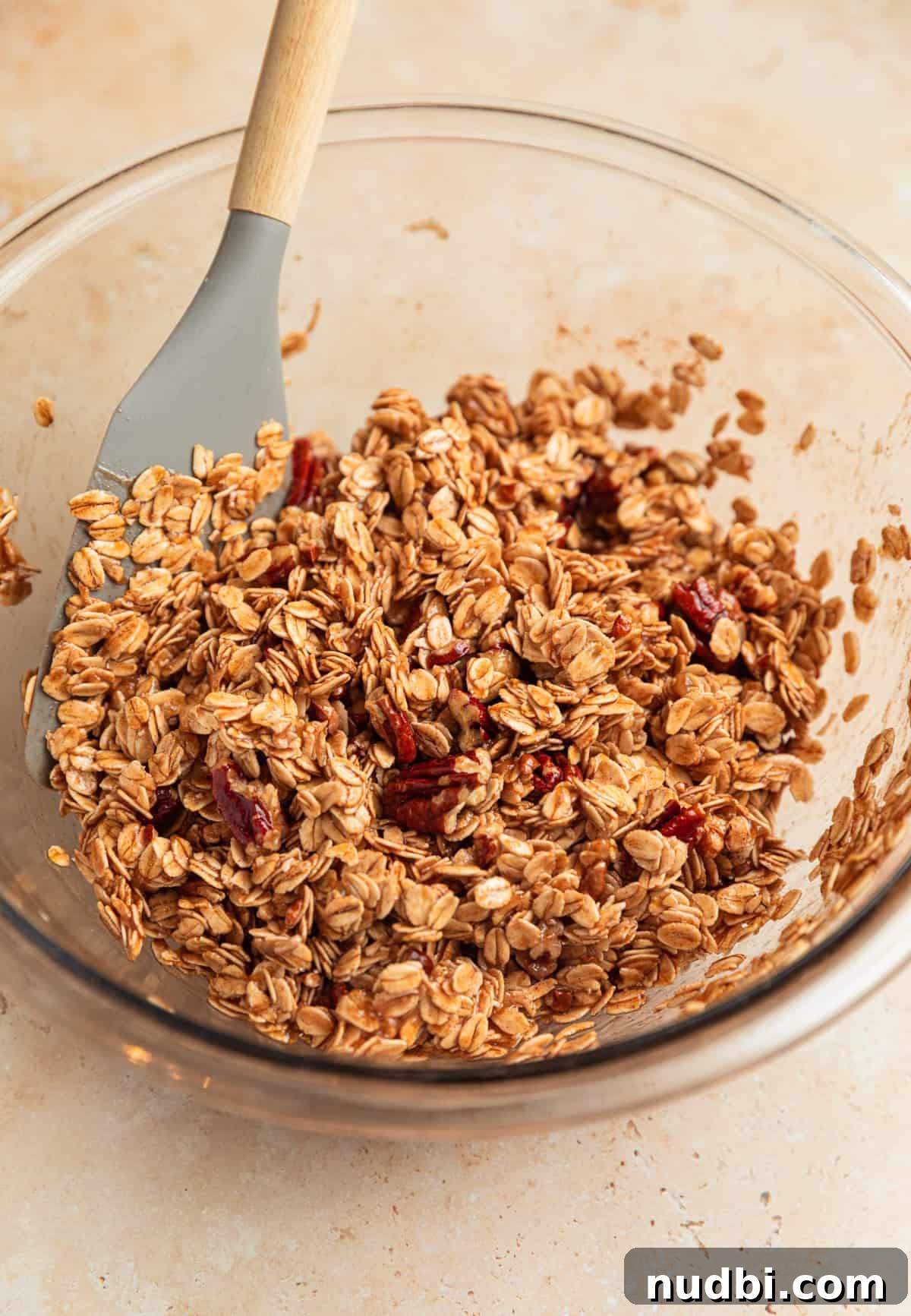 Banana Bread Granola Recipe — Crunchy Banana Oat Clusters 8 Banana bread granola mixture in bowl.