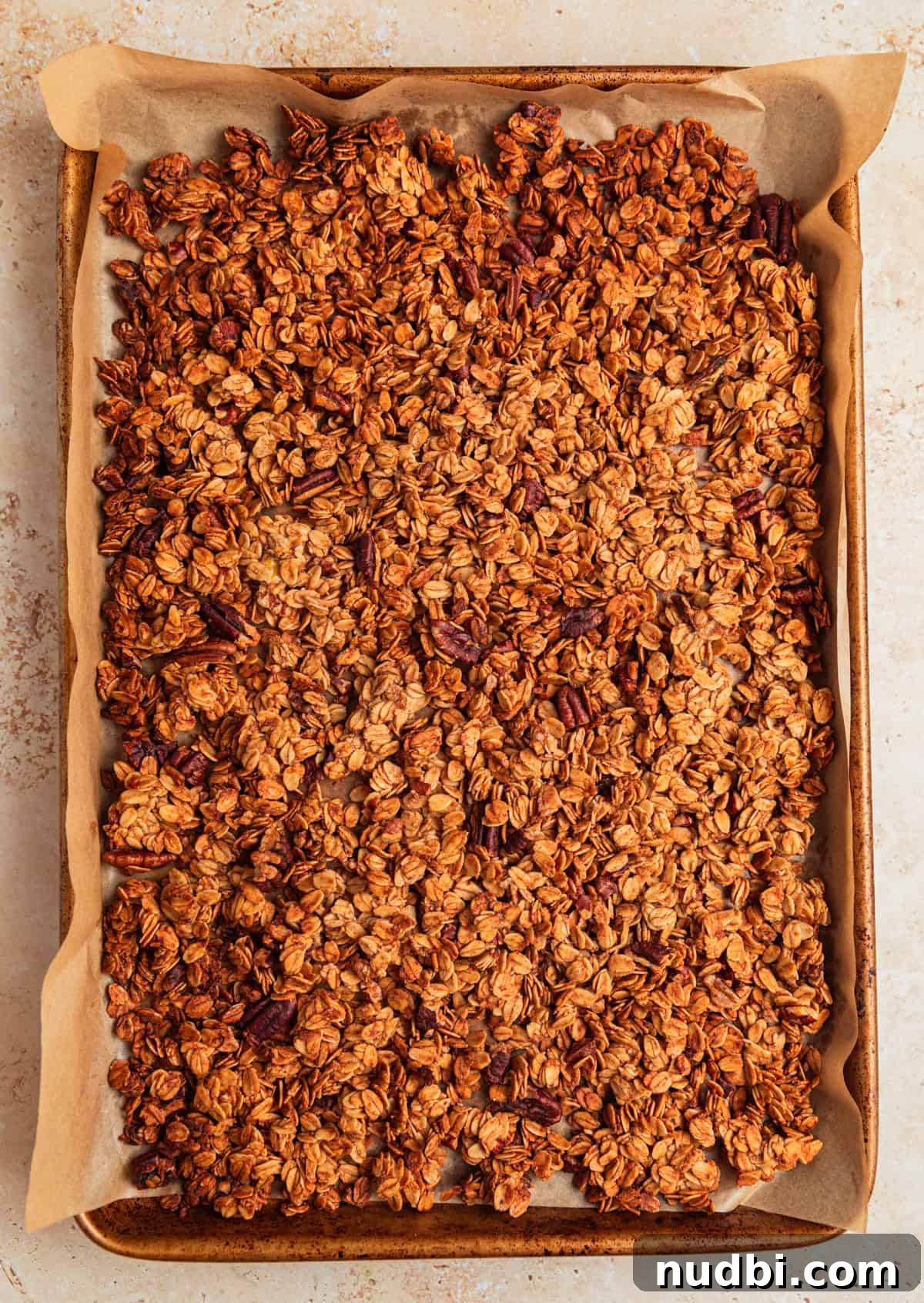 Banana Bread Granola Recipe — Crunchy Banana Oat Clusters 10 Baked banana granola on pan.
