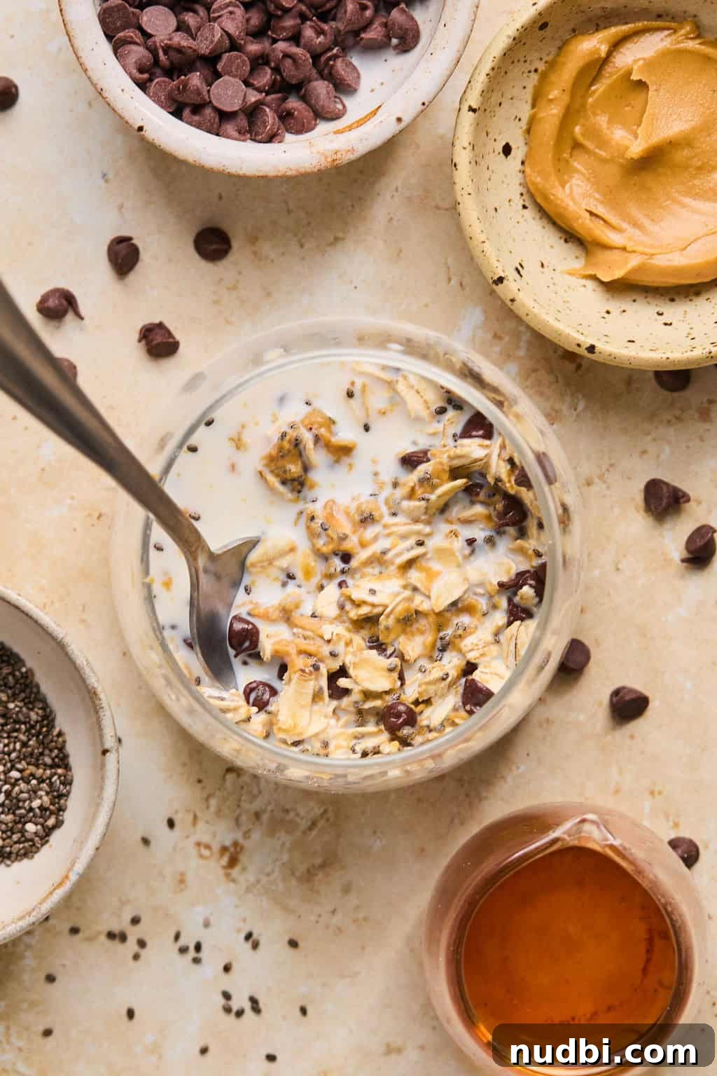 6 Overnight Oats Recipes for Quick, Nutritious Breakfasts 6 Stirred prepped oats in jar with spoon.