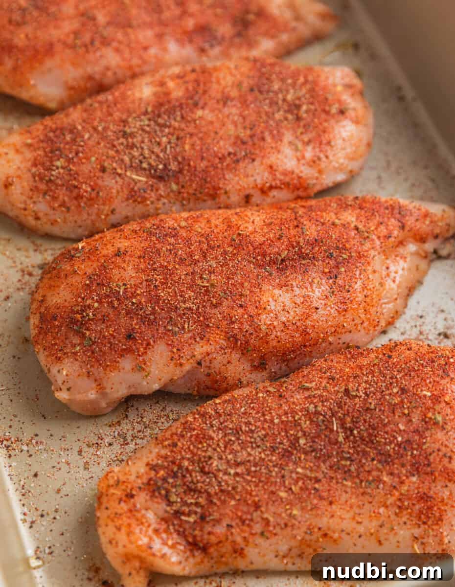 Grilled Chicken with Fresh Mango Salsa Recipe 4 Seasoned chicken before baking in baking pan.