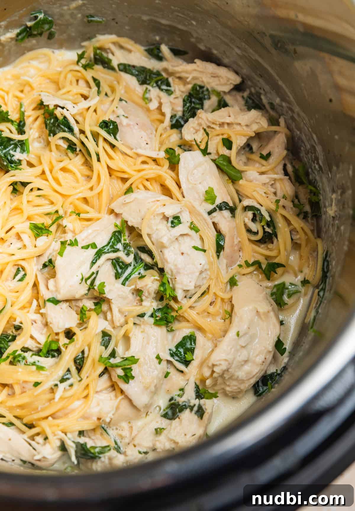 Creamy Parmesan Chicken in the Instant Pot: Tender 30-Minute Recipe 3 Instant pot with pasta and creamy chicken and spinach.