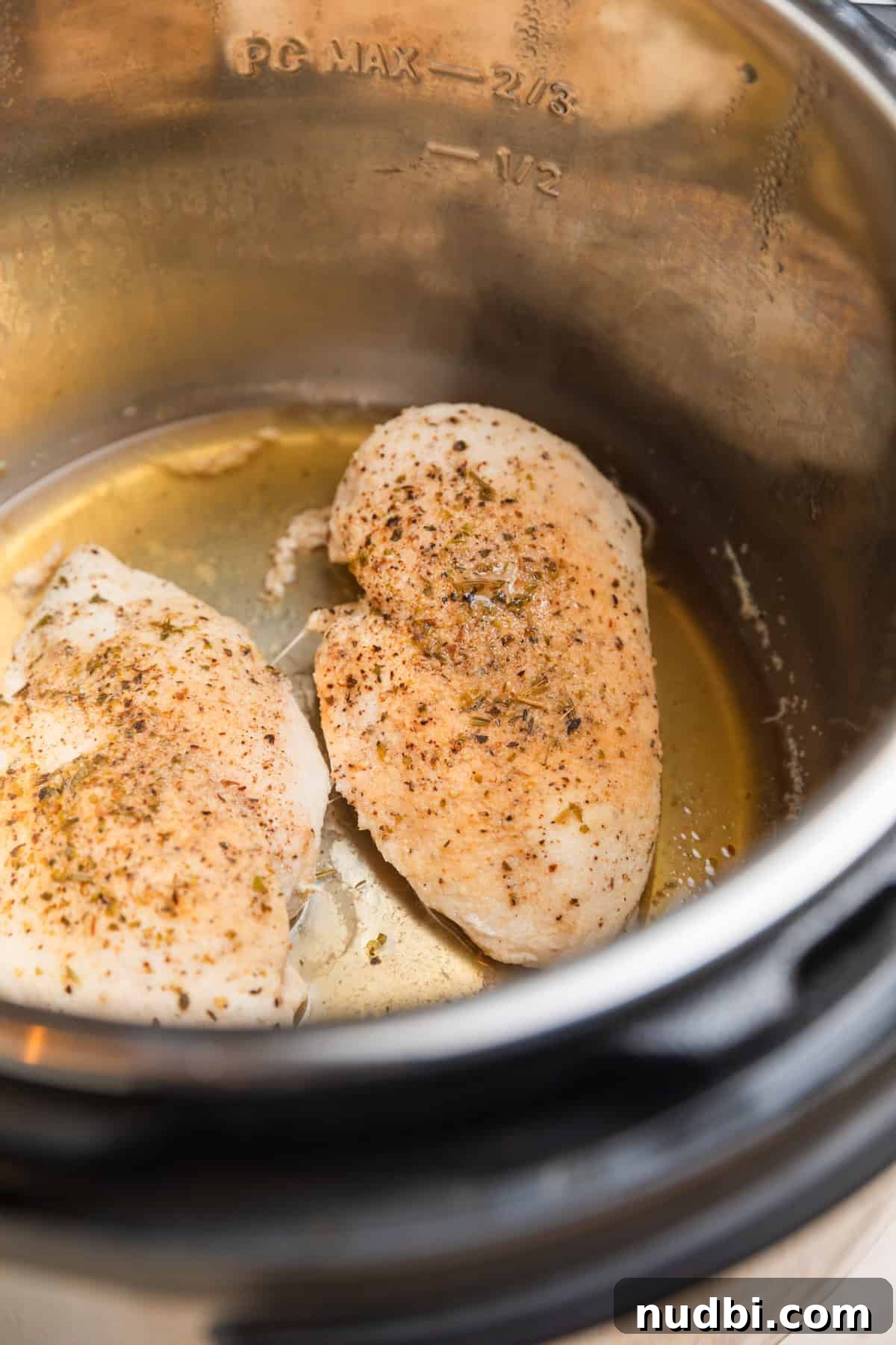 Creamy Parmesan Chicken in the Instant Pot: Tender 30-Minute Recipe 5 Cooked chicken breast in Instant pot.