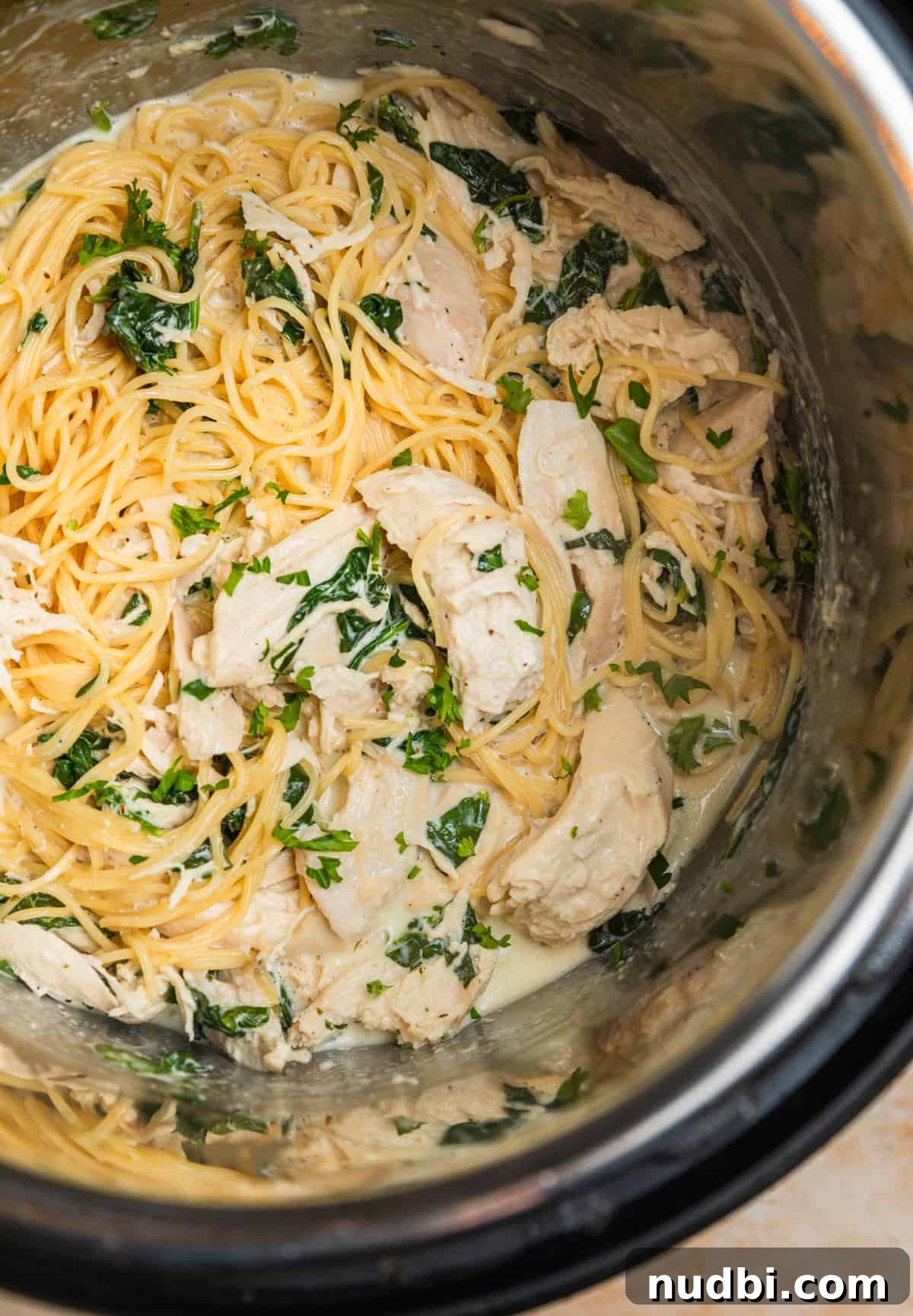 Creamy Parmesan Chicken in the Instant Pot: Tender 30-Minute Recipe 7 Instant pot with pasta tossed with creamy parmesan chicken.