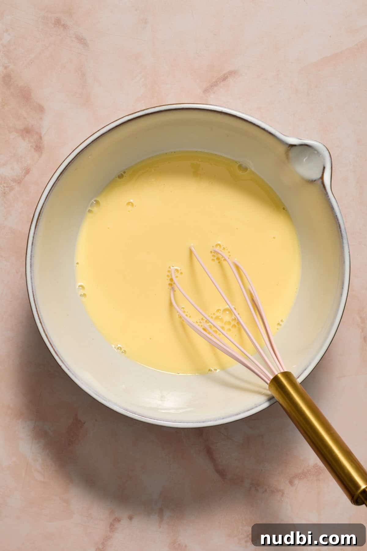 Perfect Cupcake Recipes Using Cake Mix for Fluffy Results 5 Eggs and milk whisked together in mixing bowl.