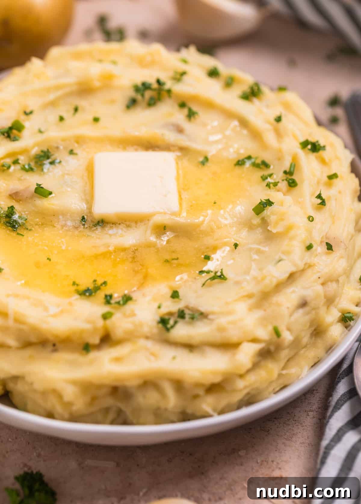 Garlic Parmesan Mashed Potatoes Made in the Instant Pot 7 Melted butter on top of Instant Pot garlic parmesan mashed potatoes.