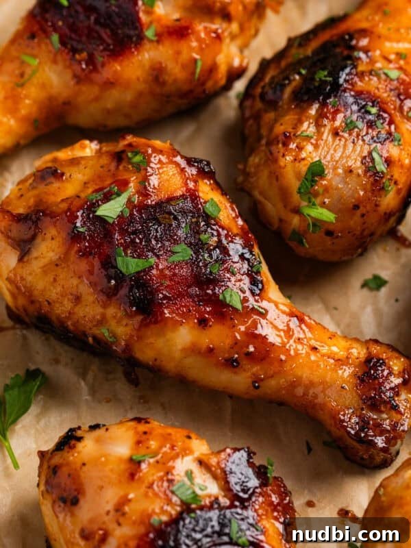 Spicy Cilantro Lime Black Bean Burgers 11 Honey mustard chicken drumsticks on parchment with chopped parsley.