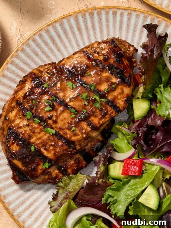 Spicy Cilantro Lime Black Bean Burgers 13 Grilled balsamic chicken breast served on plate topped with chopped parsley.