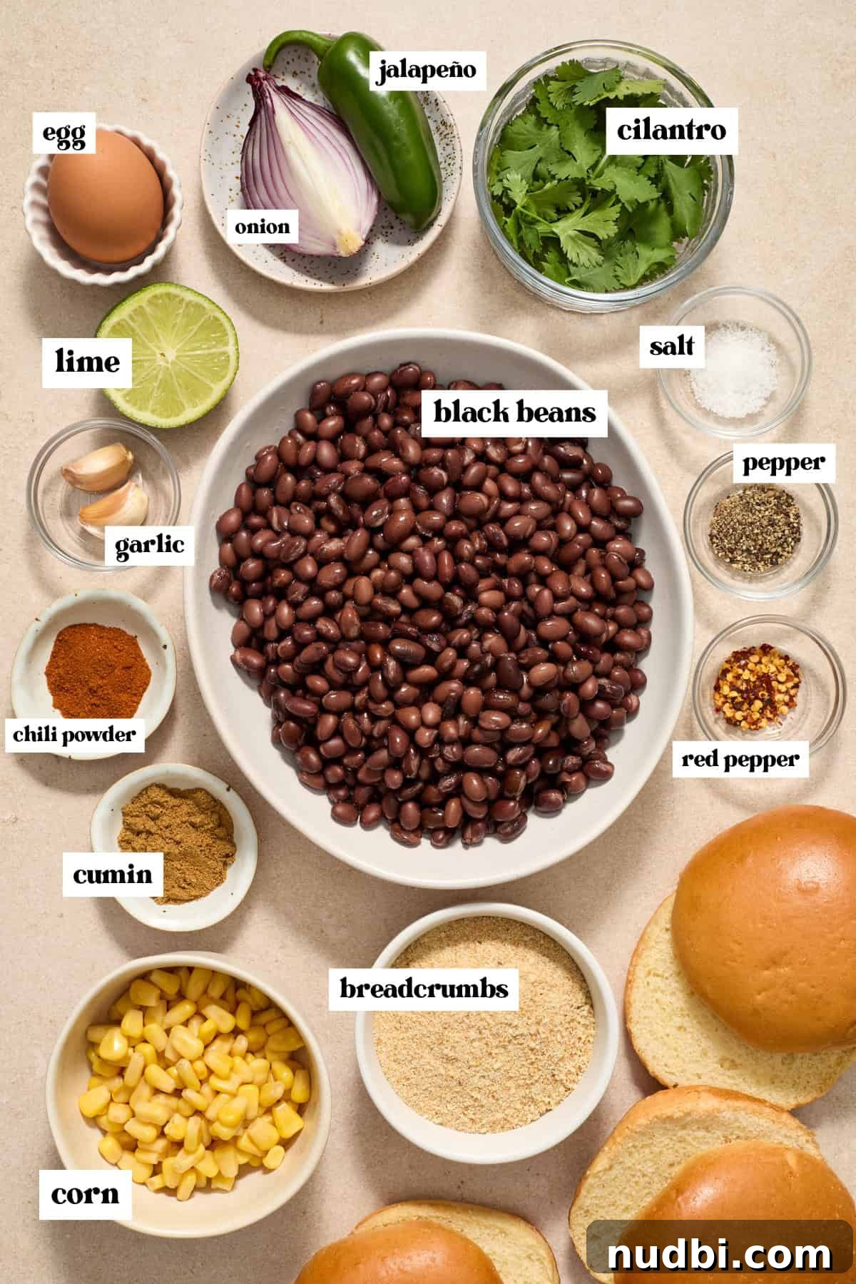 Spicy Cilantro Lime Black Bean Burgers 3 Dish with black beans, spices, egg and other labeled ingredients on surface.