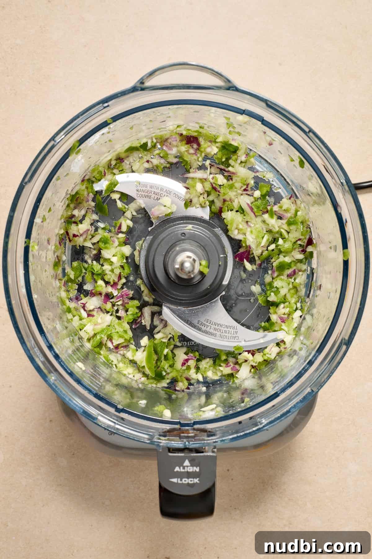 Spicy Cilantro Lime Black Bean Burgers 4 Chopped peppers and onions in food processor.