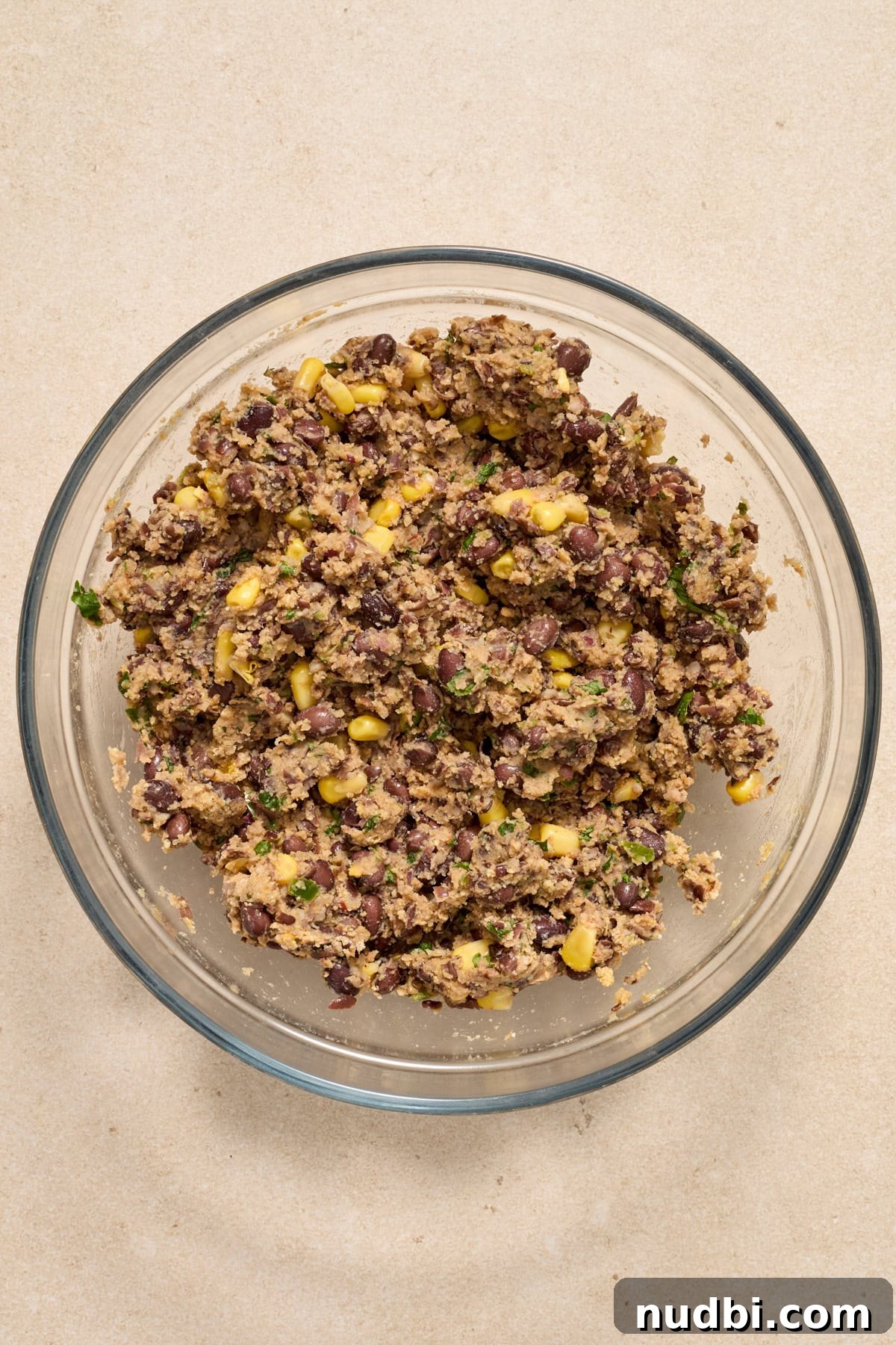 Spicy Cilantro Lime Black Bean Burgers 7 Spicy black bean burger mixture in glass mixing bowl.