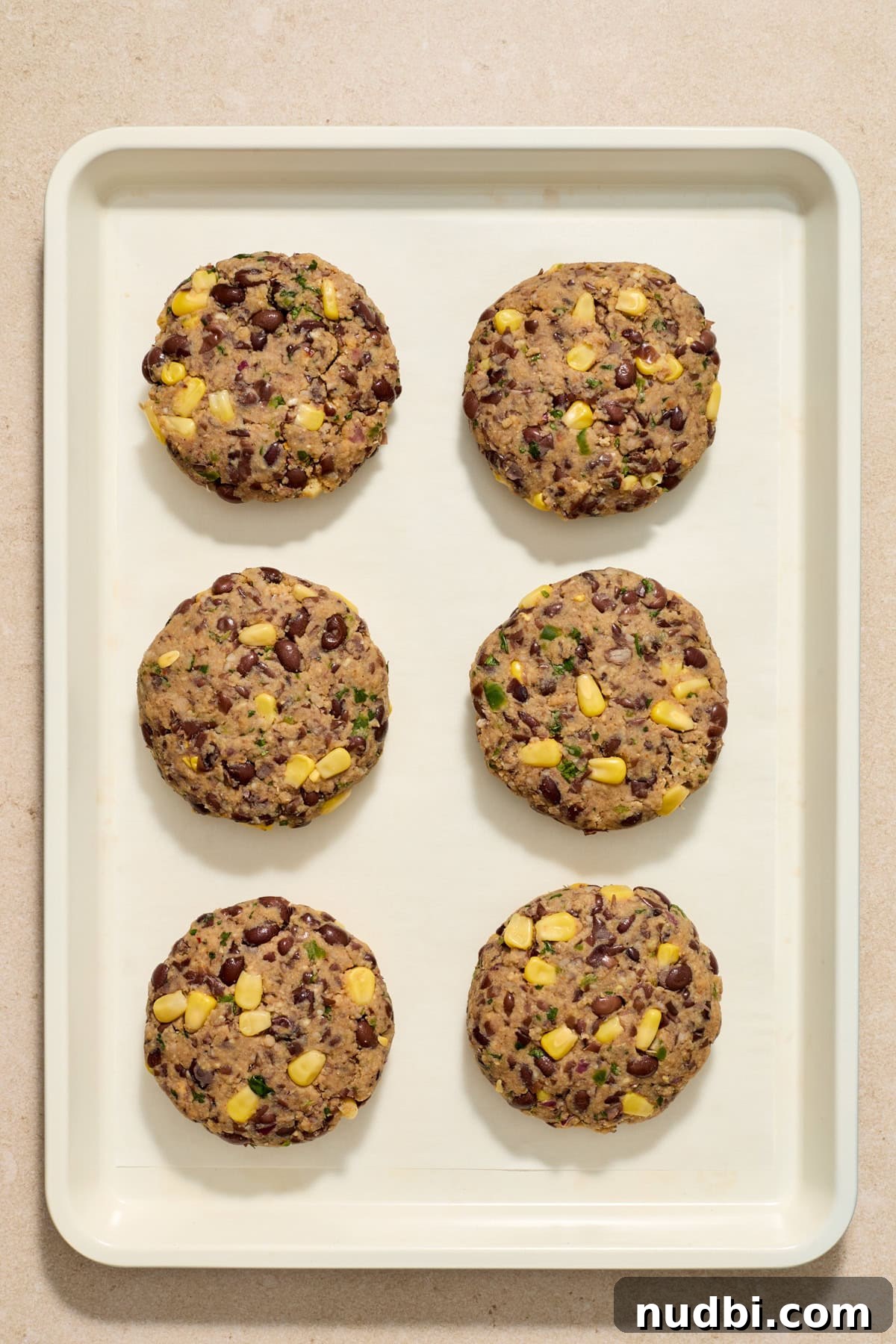Spicy Cilantro Lime Black Bean Burgers 8 Formed black bean burgers formed on sheet pan.