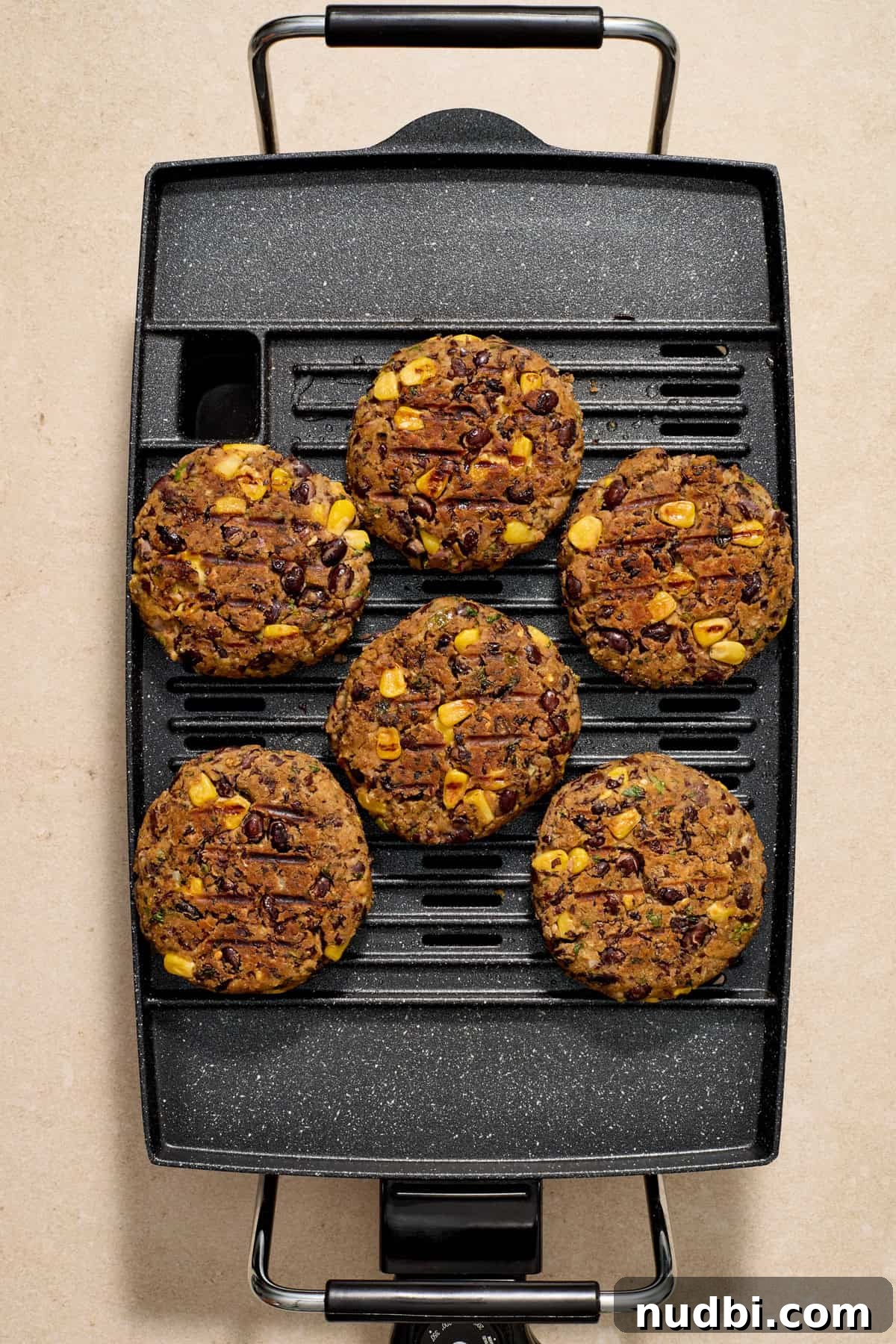 Spicy Cilantro Lime Black Bean Burgers 9 Grilled black bean burgers on grill.