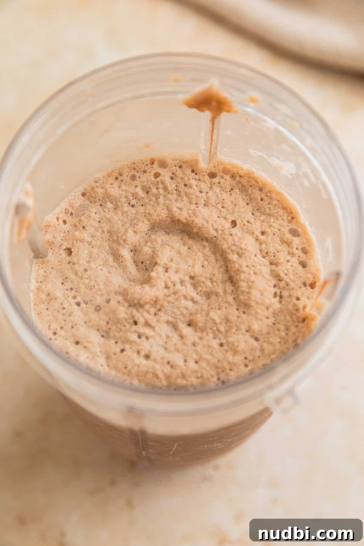 Homemade Mocha Frappuccino Recipe for Café-Style Iced Coffee 5 Blended coffee drink in blender cup.