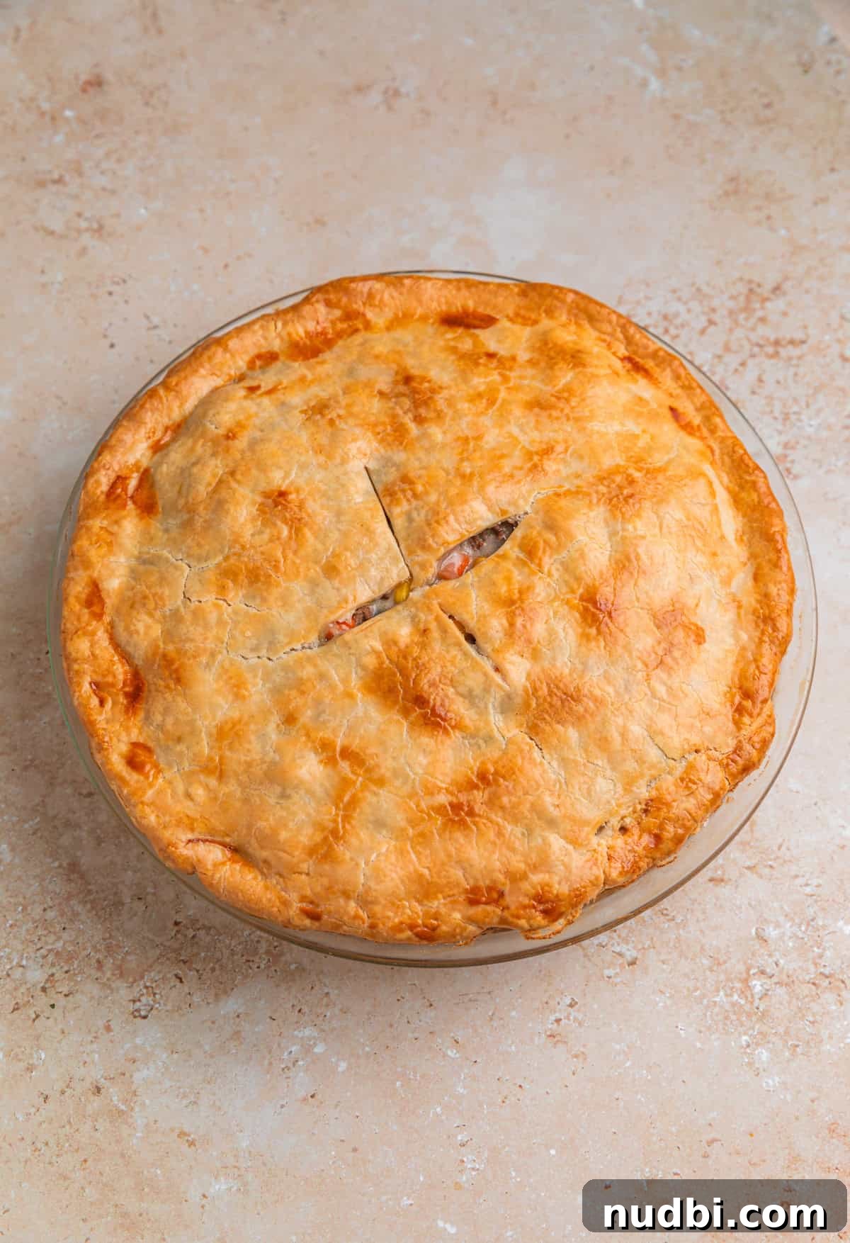 Savory Ground Beef Pot Pie Recipe with Flaky Crust 11 Ground beef pot pie fresh from the oven in pie dish.