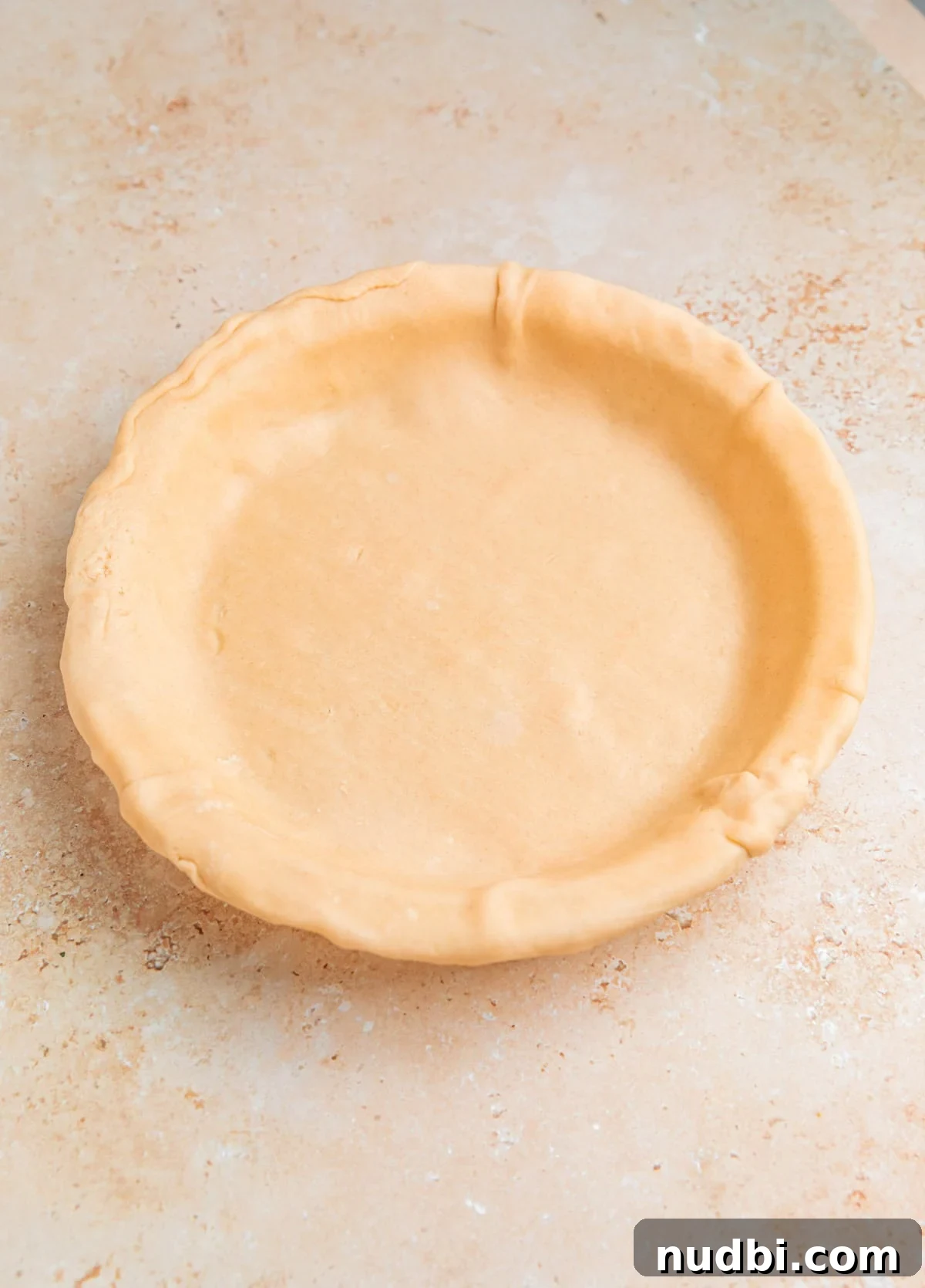 Savory Ground Beef Pot Pie Recipe with Flaky Crust 7 Pie crust pressed into pie dish.