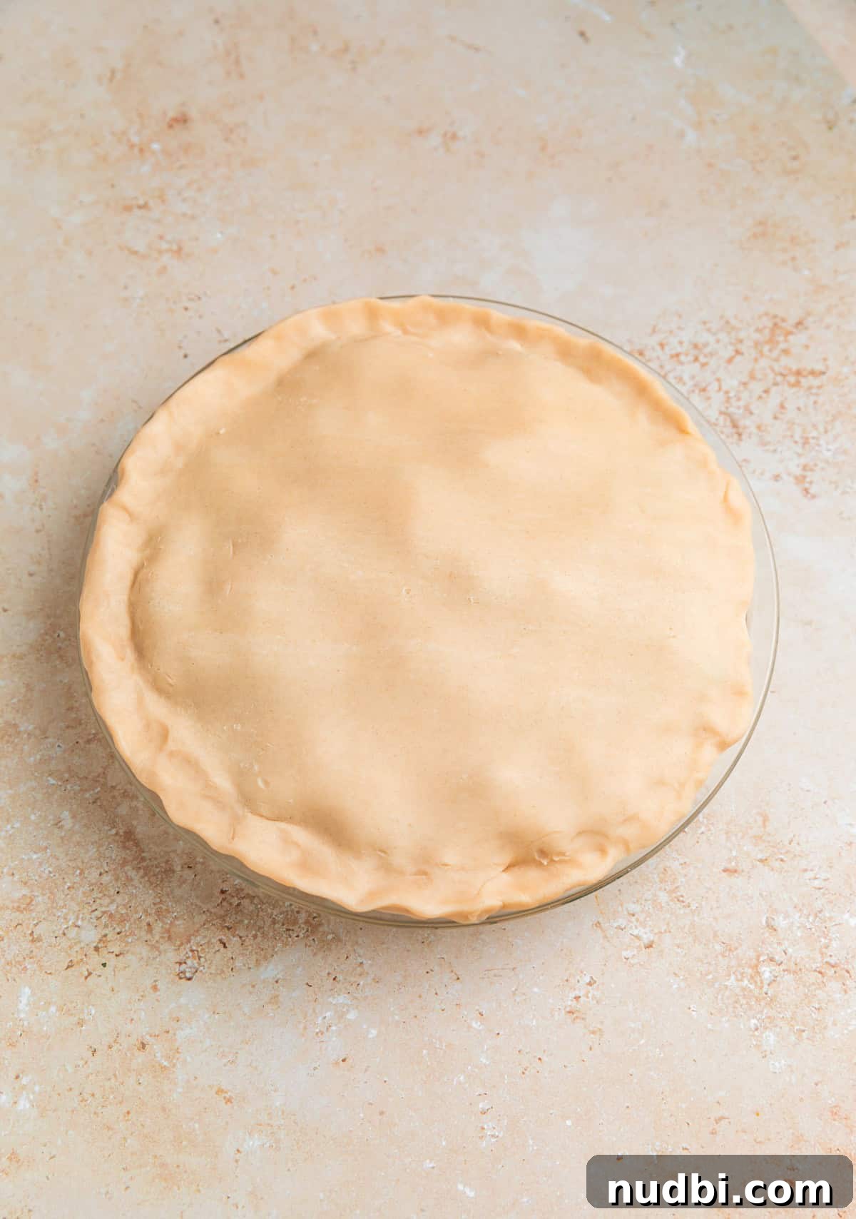 Savory Ground Beef Pot Pie Recipe with Flaky Crust 9 Top layer of pie crust added over top of pie.
