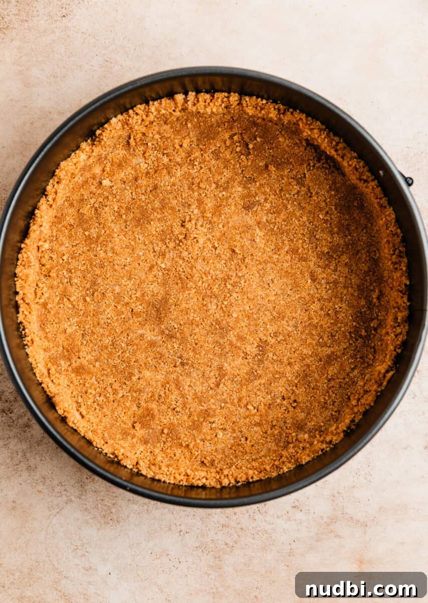 No-Bake Caramel Apple Cheesecake Recipe for Fall Gatherings 7 Springform pie pan with graham cracker crust pressed in.