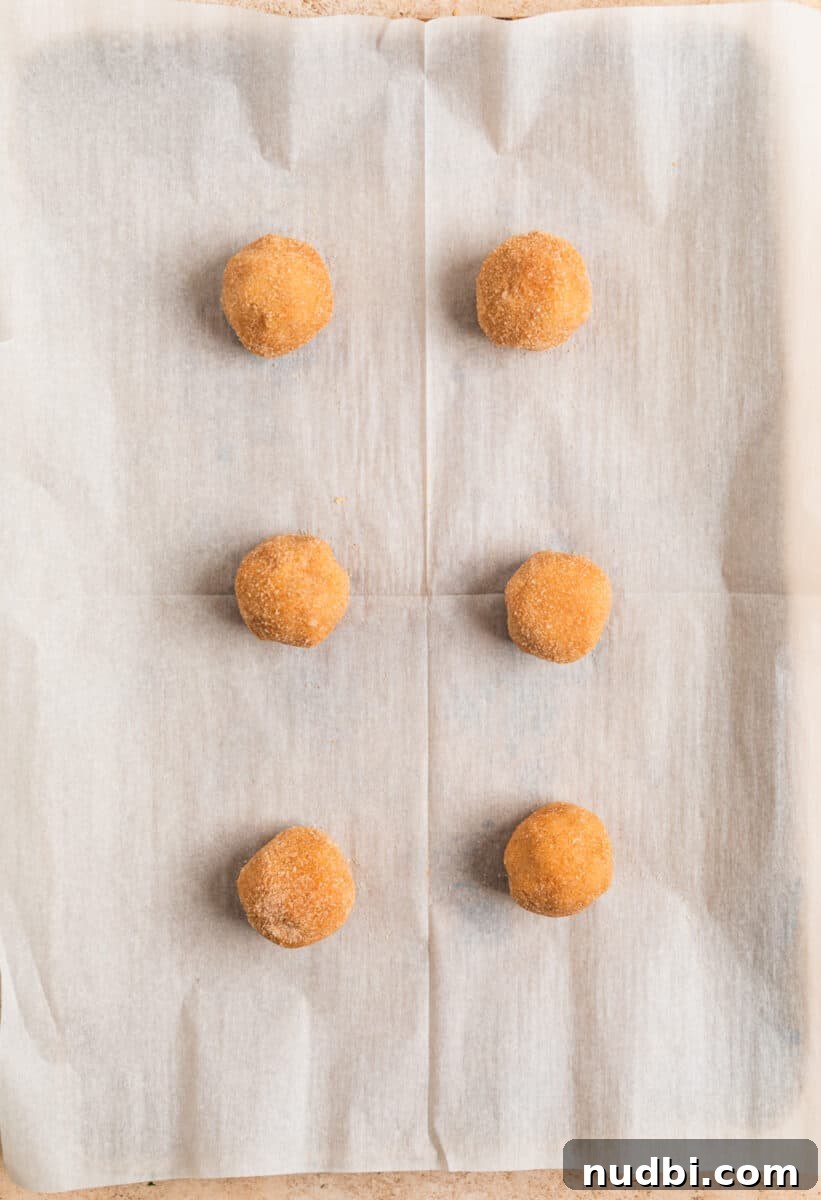 Chewy Snickerdoodle Cookies Filled with Caramel 13 Lined cookie dough on cookie sheet.
