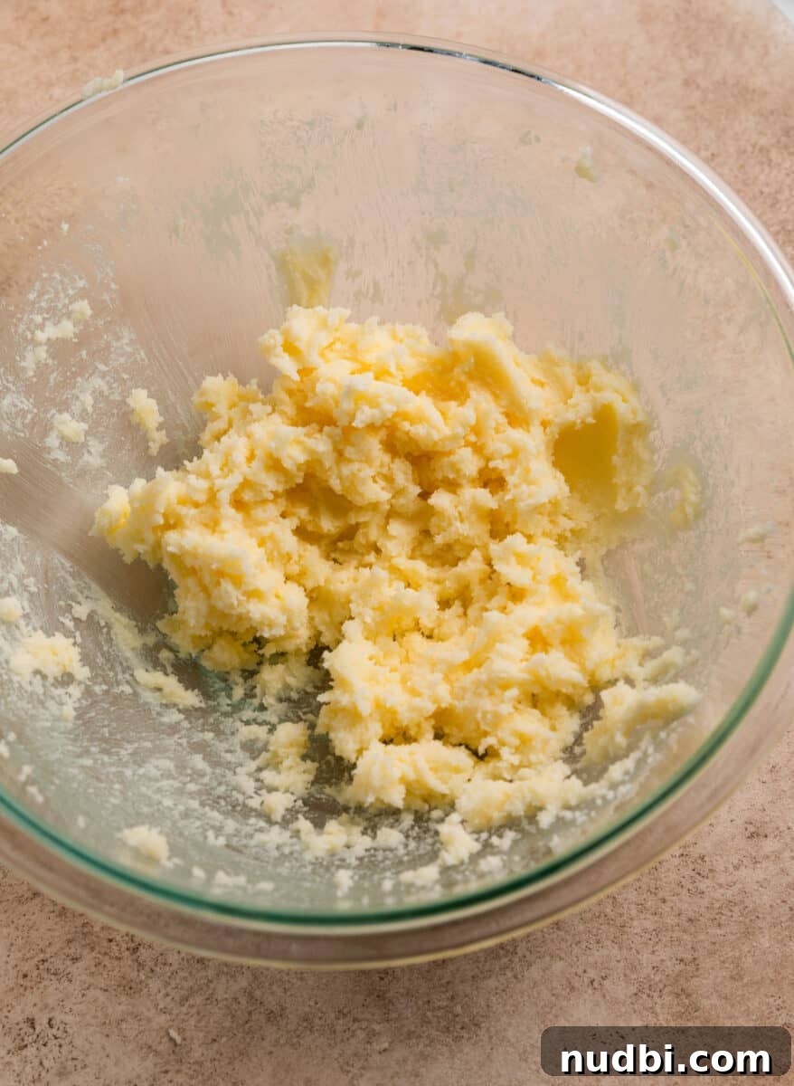 Chewy Snickerdoodle Cookies Filled with Caramel 5 Creamed butter and sugar in mixing bowl.