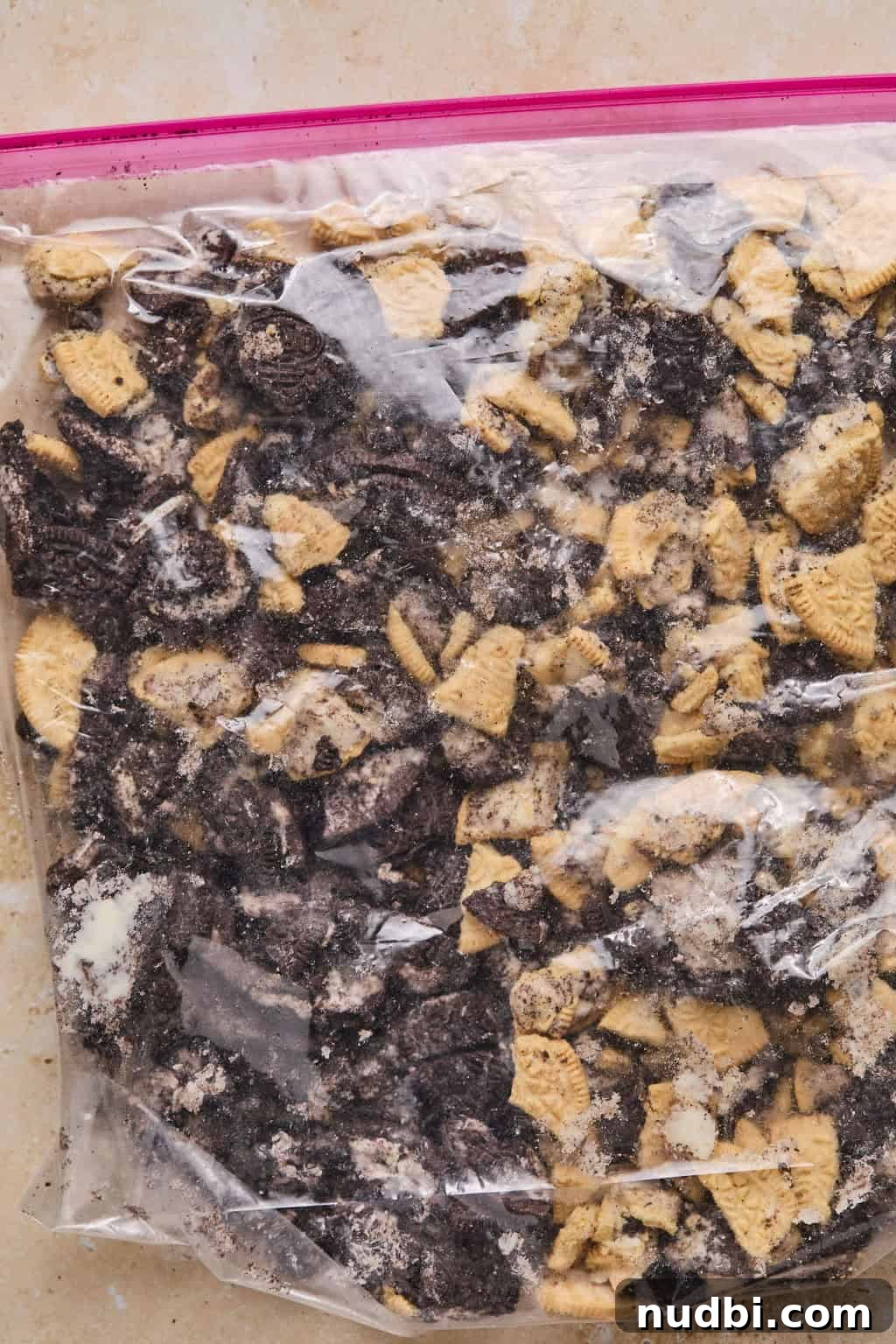 Oreo Chocolate Chip Cookies Recipe — Chewy Oreo-Stuffed Treats 4 Crushed Oreo cookies in plastic bag.