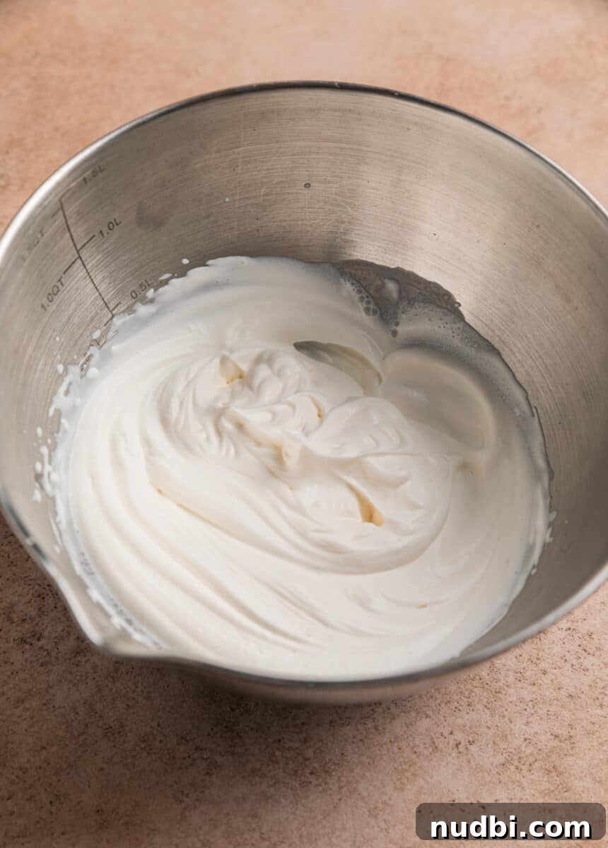 Red Velvet Cheesecake Dip Recipe — Creamy Party Dessert Dip 4 Heavy whipping cream in bowl beaten to stiff peaks.
