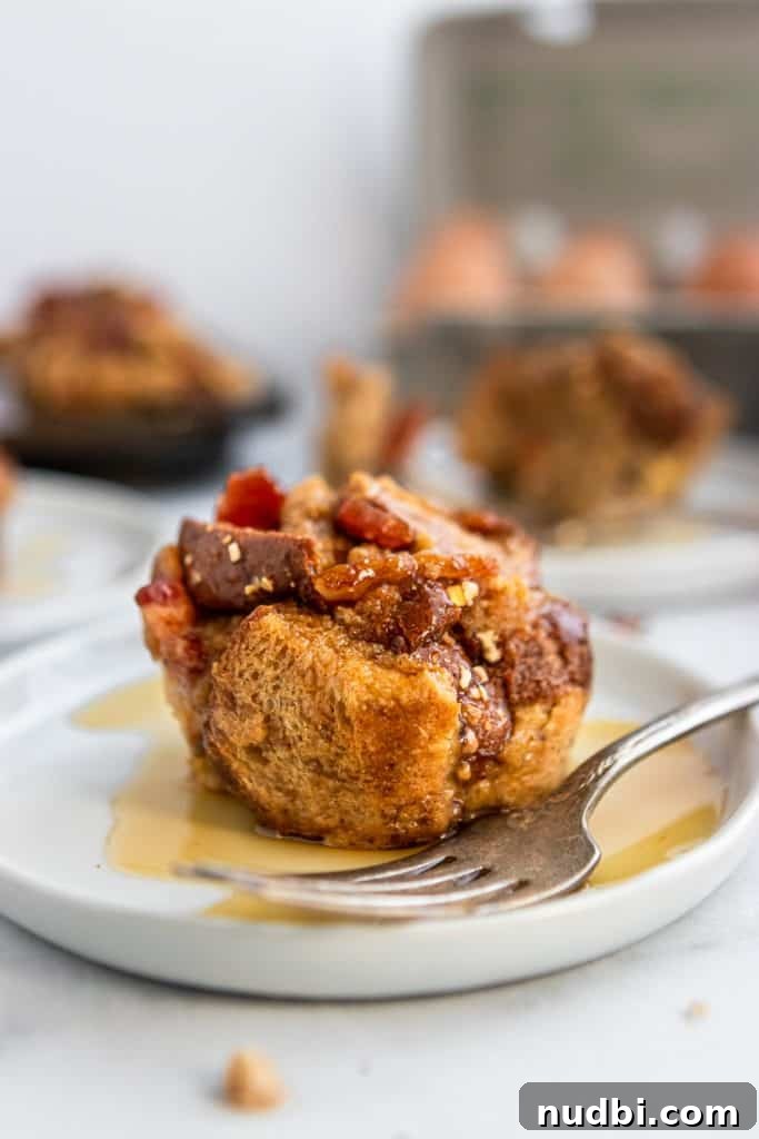 Maple Bacon French Toast Muffins Recipe for Brunch or Breakfast 5 Plate with maple soaked french toast muffin and fork.