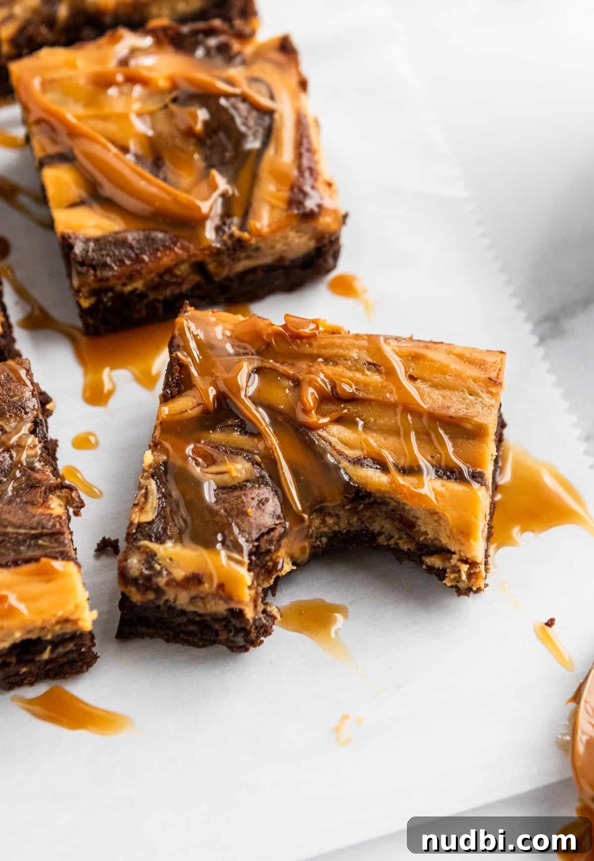 Dulce de Leche Cream Cheese Brownies Recipe for Gooey Bars 2 Dulce De Leche Cheesecake Brownies bite shot.