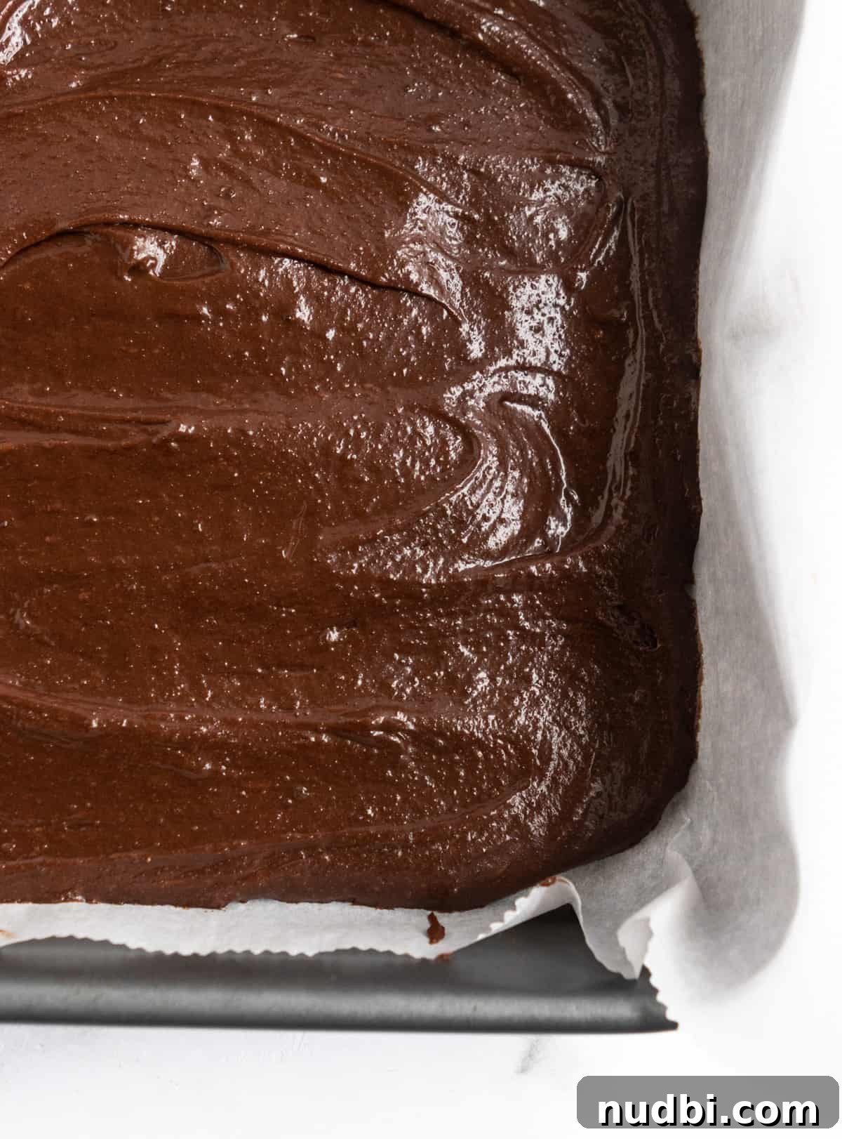Dulce de Leche Cream Cheese Brownies Recipe for Gooey Bars 7 Brownie batter in parchment lined pan.