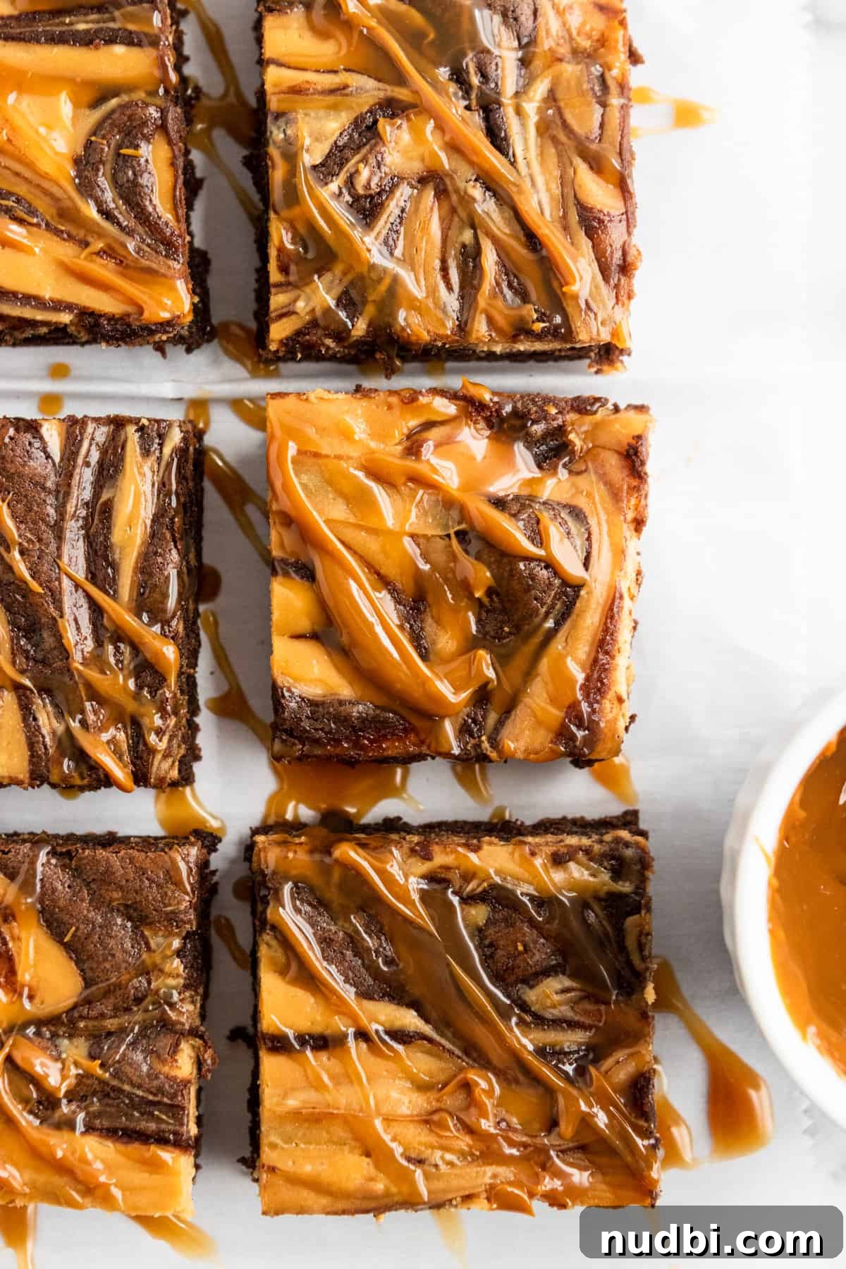Dulce de Leche Cream Cheese Brownies Recipe for Gooey Bars 9 Overhead shot of brownies with dulce de leche drizzle.