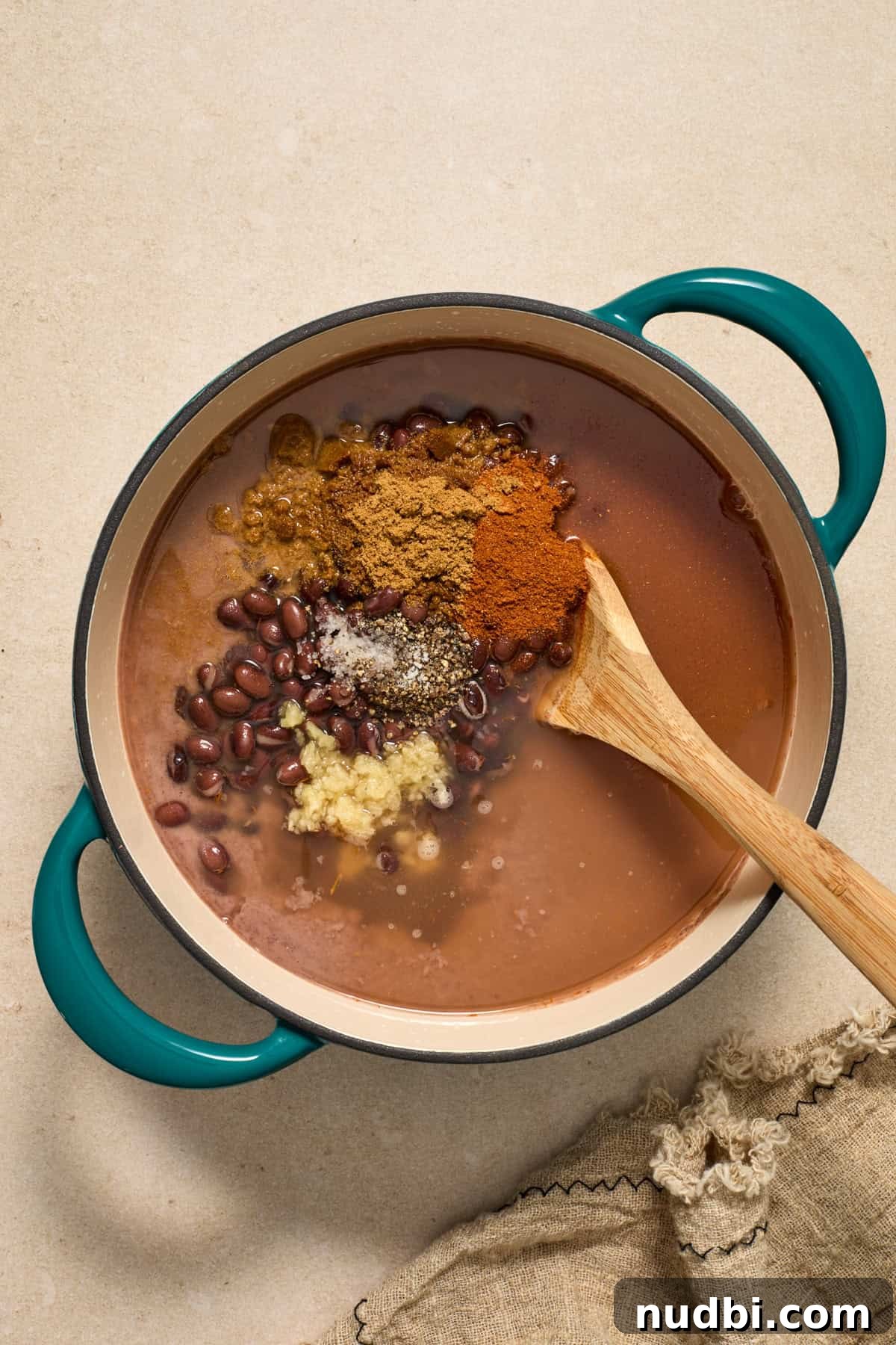 20-Minute Hearty Black Bean Soup Recipe for Weeknight Dinners 7 Black bean and salsa purée added to pot with spices.