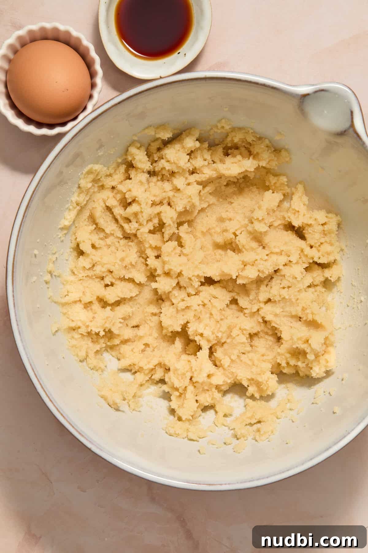 Funfetti Birthday Cake Cookies Recipe for Colorful Party Treats 4 Butter and sugars creamed in mixing bowl with vanilla extract and egg beside bowl