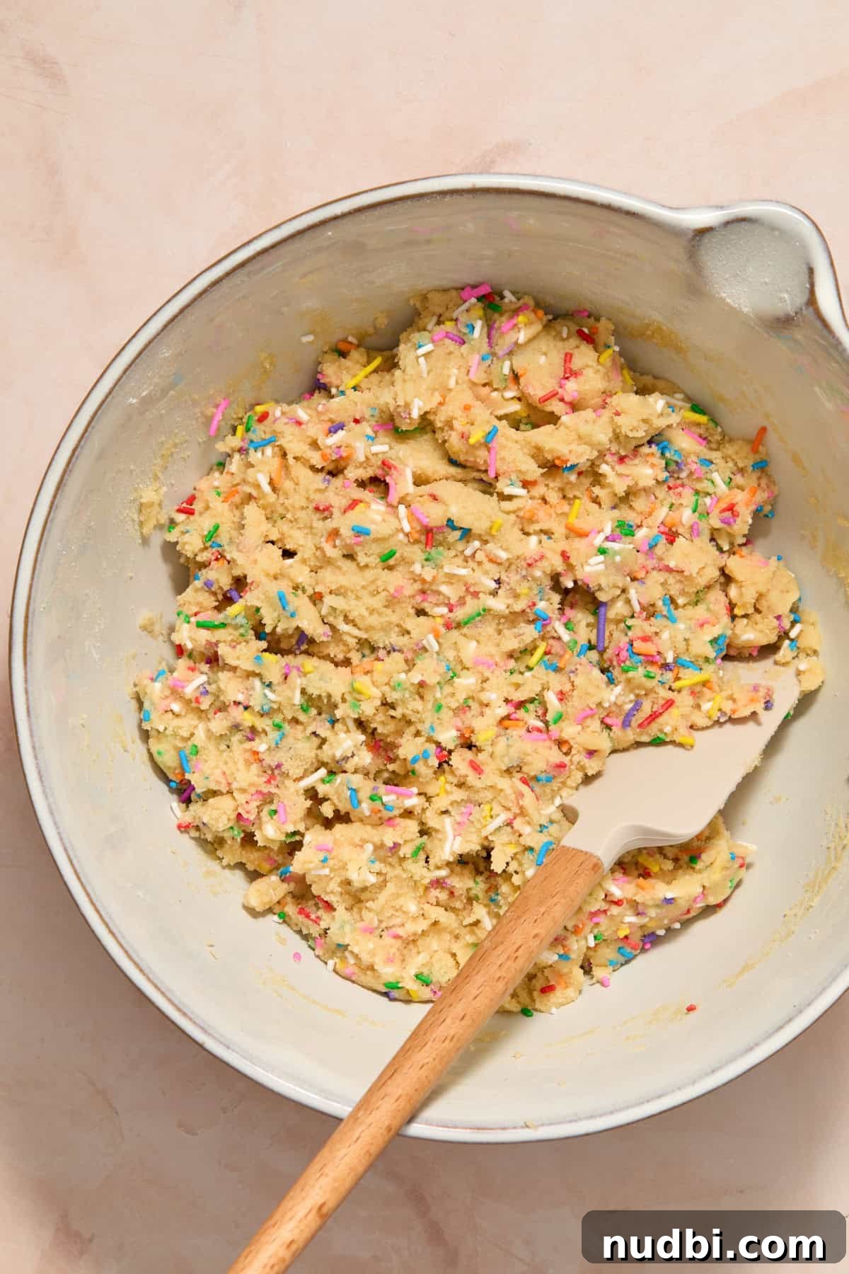 Funfetti Birthday Cake Cookies Recipe for Colorful Party Treats 9 Spatula in bowl with funfetti cookie dough.