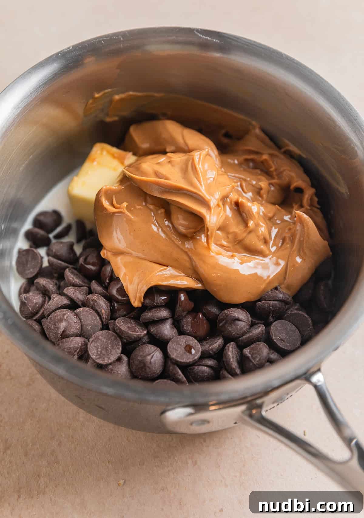 No-Bake Peanut Butter Chocolate Oatmeal Bars Recipe 3 Peanut butter, chocolate chips, butter, milk, vanilla in small sauce pan.