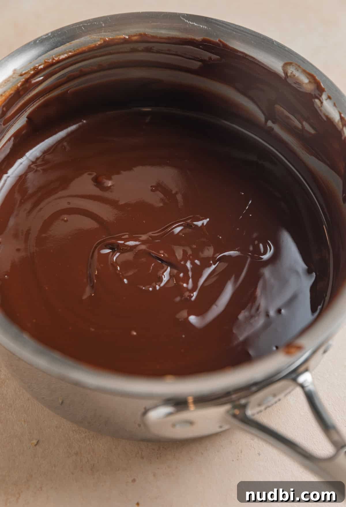 No-Bake Peanut Butter Chocolate Oatmeal Bars Recipe 4 Melted peanut butter and chocolate mixture in sauce pan.