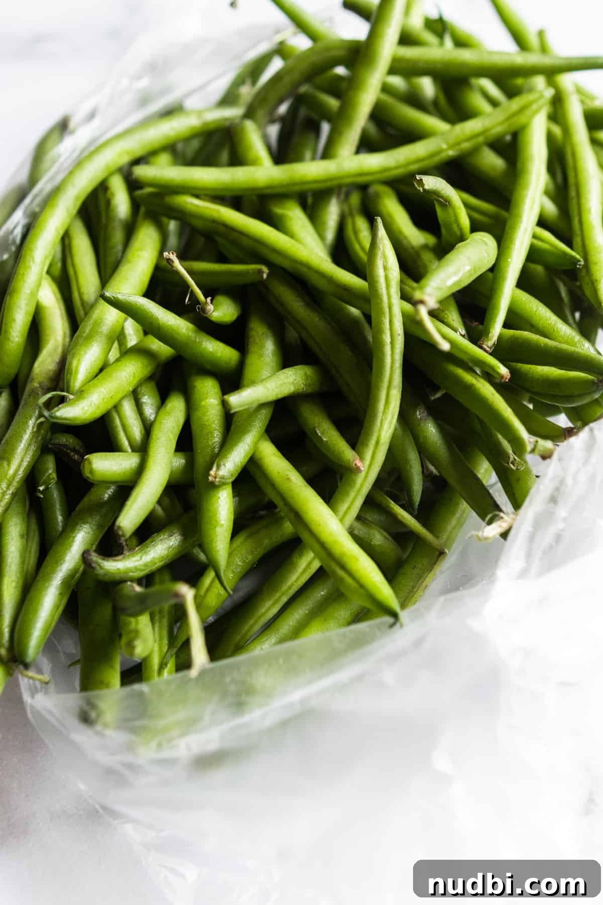 Crispy Roasted Parmesan Green Beans Recipe for Weeknight Dinner 5 Fresh green beans in plastic bag.