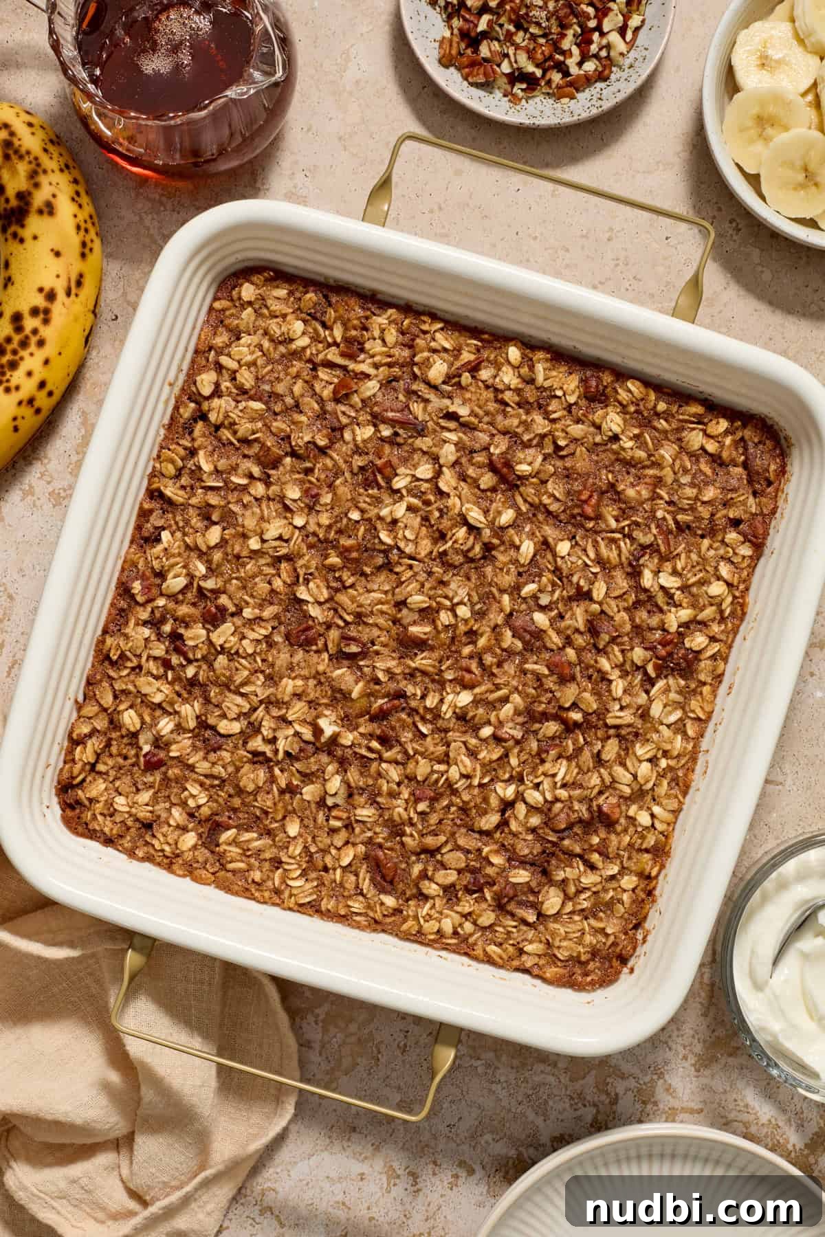 Banana Bread Baked Oatmeal Recipe for Breakfast and Meal Prep 4 Pan with banana bread baked oatmeal.